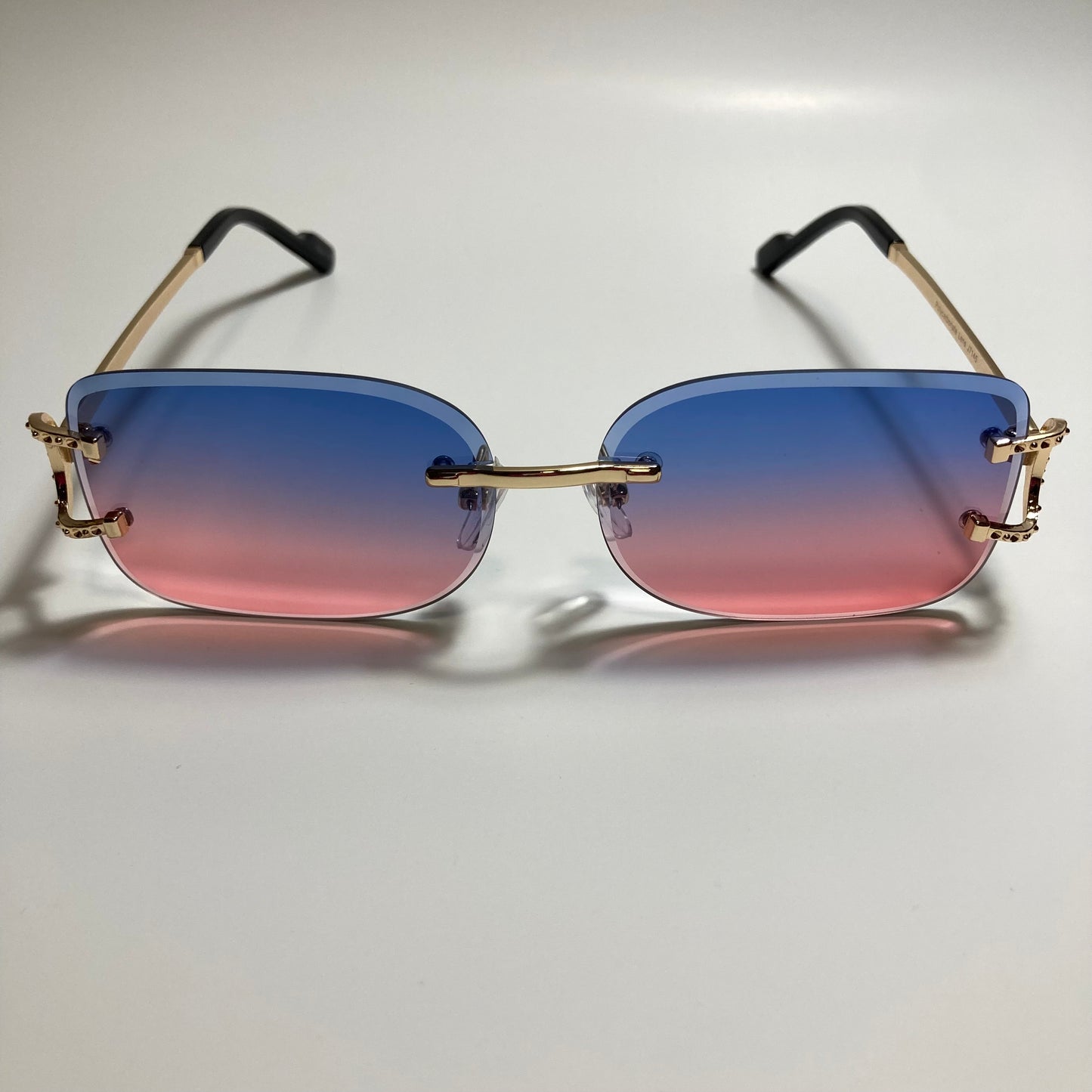 mens and womens pink blue and gold rimless square sunglasses