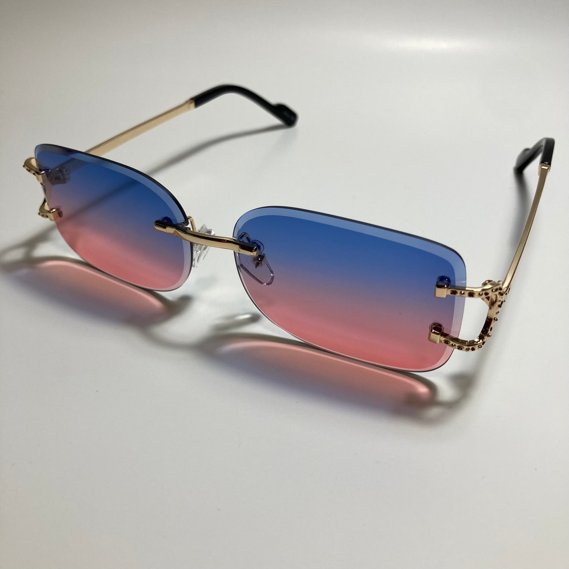 mens and womens pink blue and gold rimless square sunglasses
