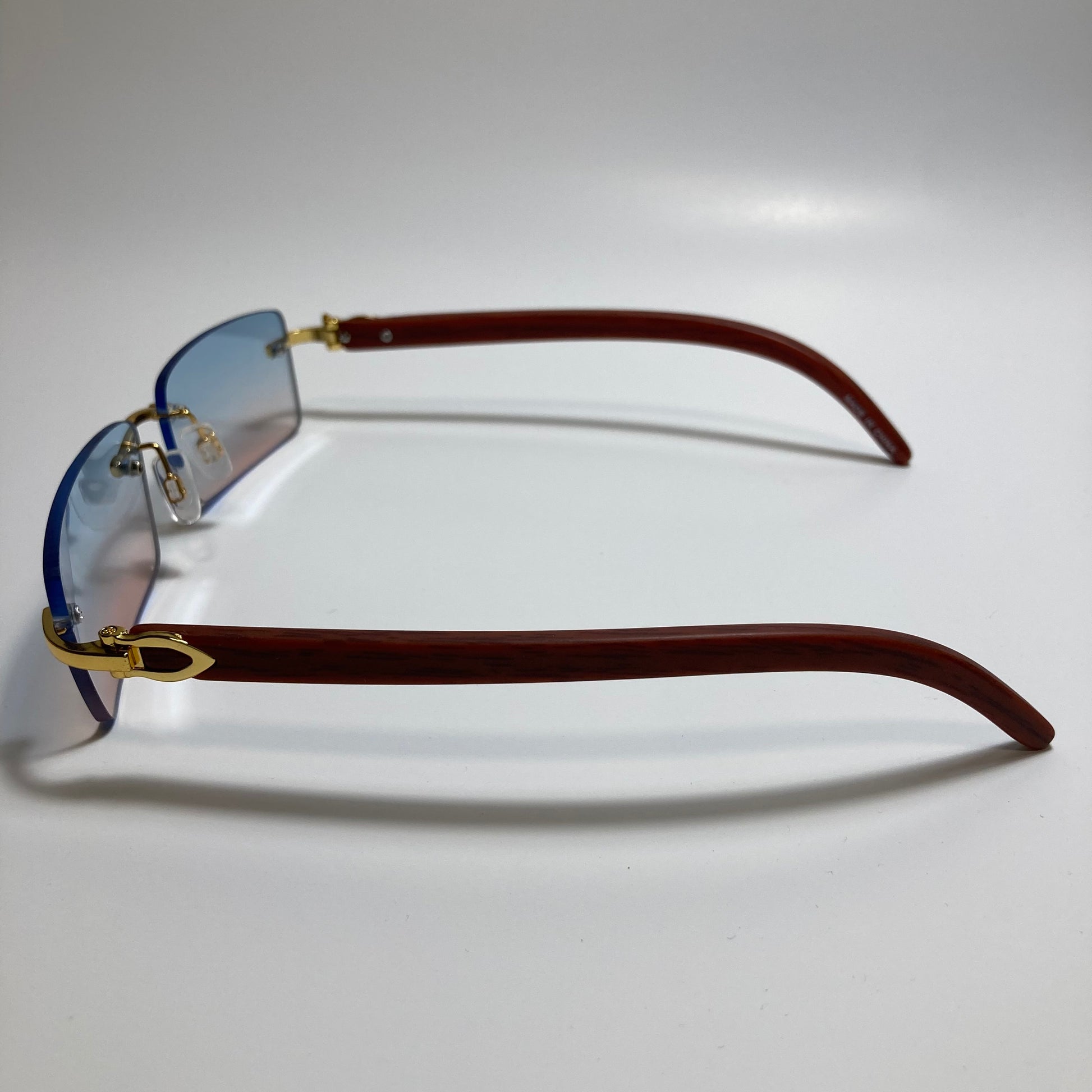 mens and womens pink and blue rimless square sunglasses