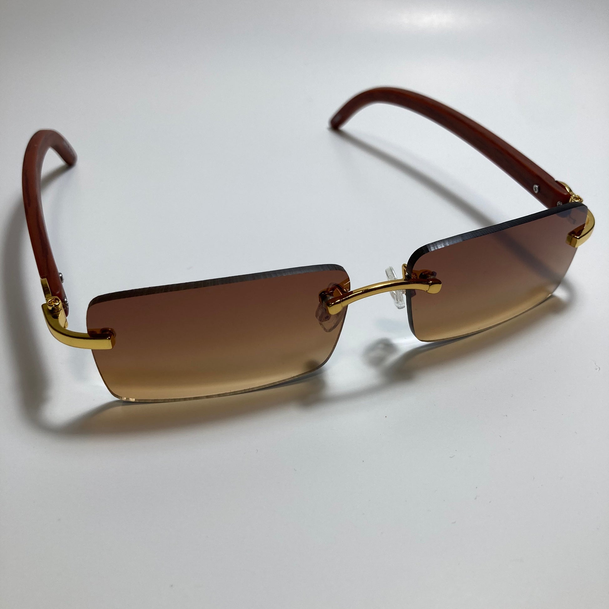 mens and womens brown rimless square sunglasses