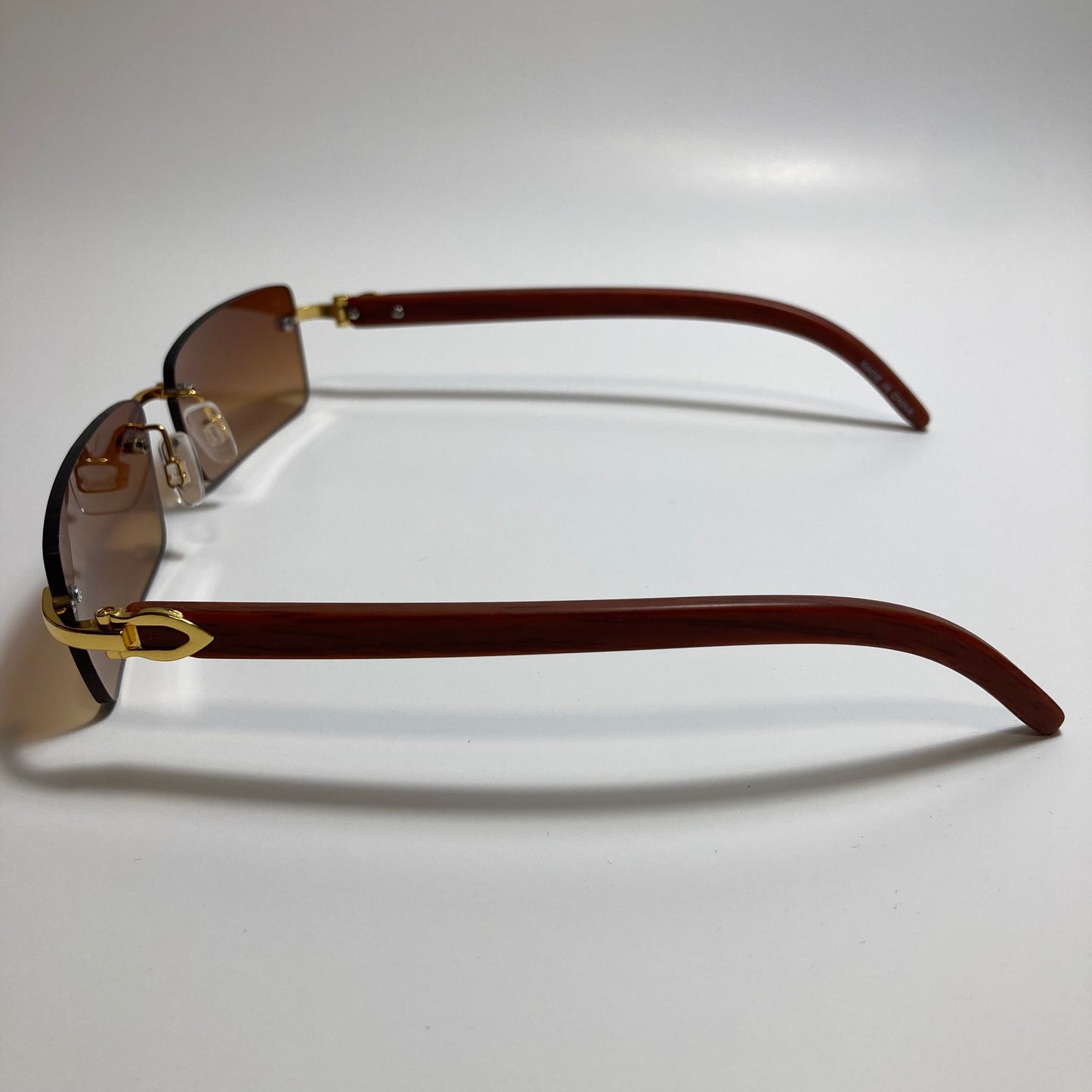 mens and womens brown rimless square sunglasses