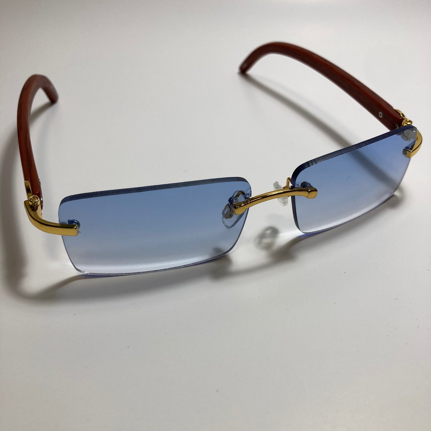 mens and womens blue rimless square sunglasses