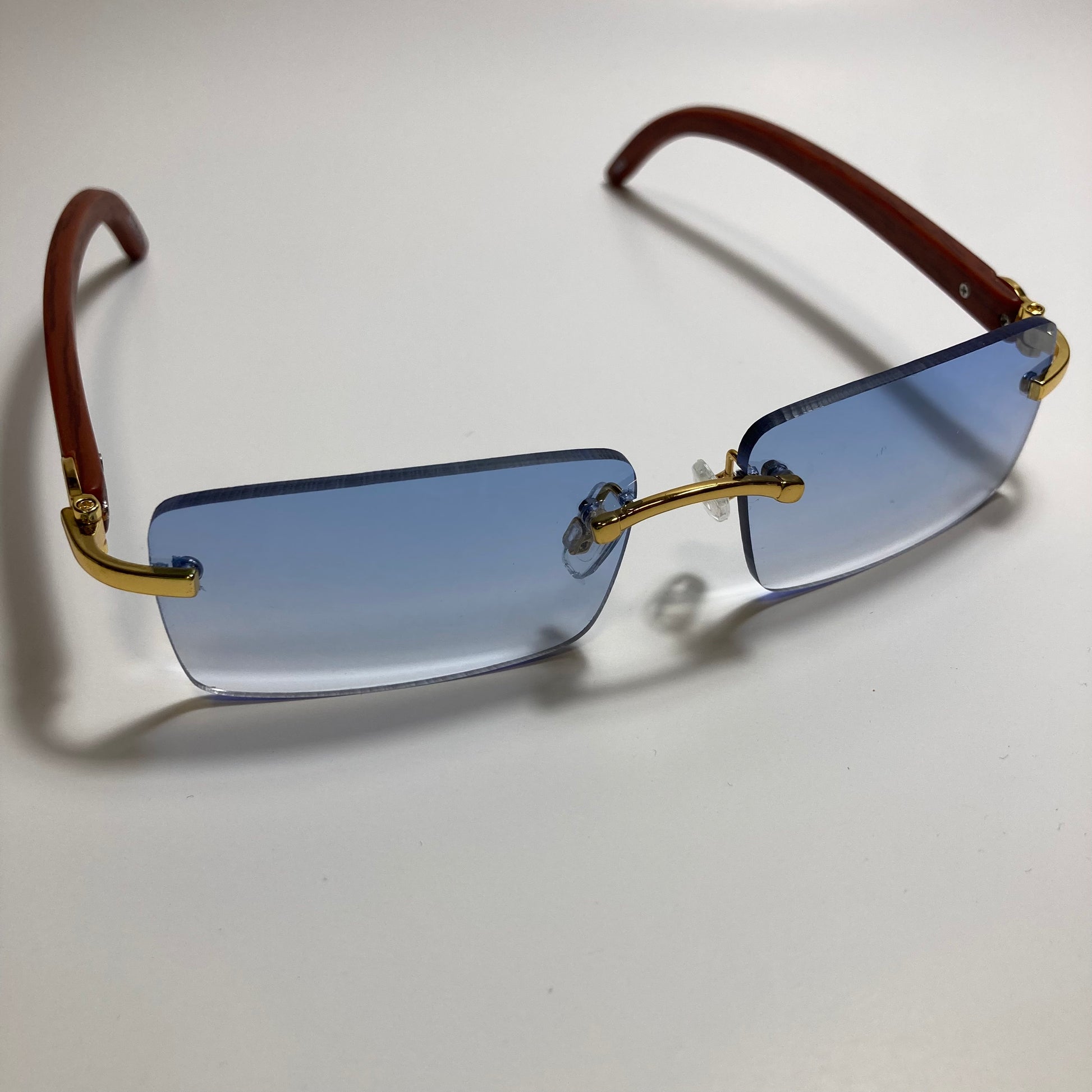 mens and womens blue rimless square sunglasses