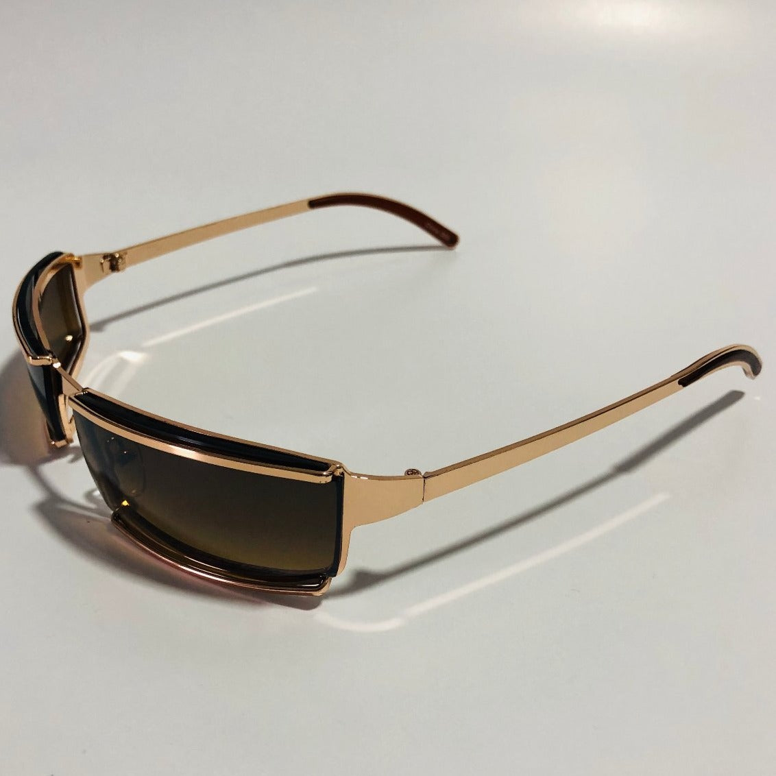 mens and womens gold wrap sunglasses with brown lenses