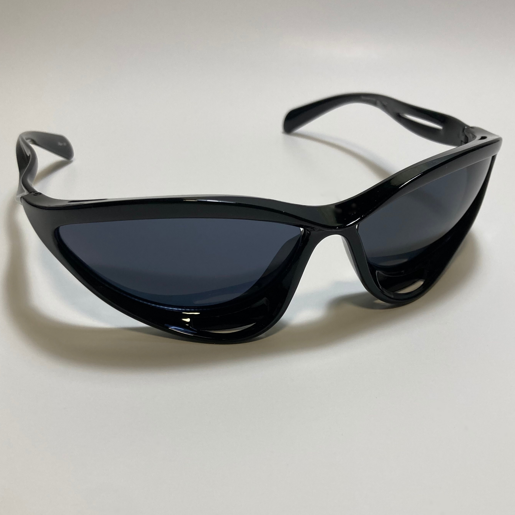 mens and womens gloss black and black lens futuristic sunglasses