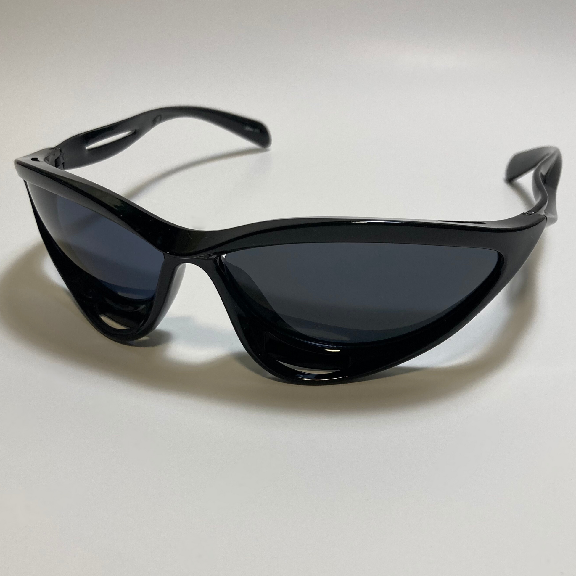 mens and womens gloss black and black lens futuristic sunglasses