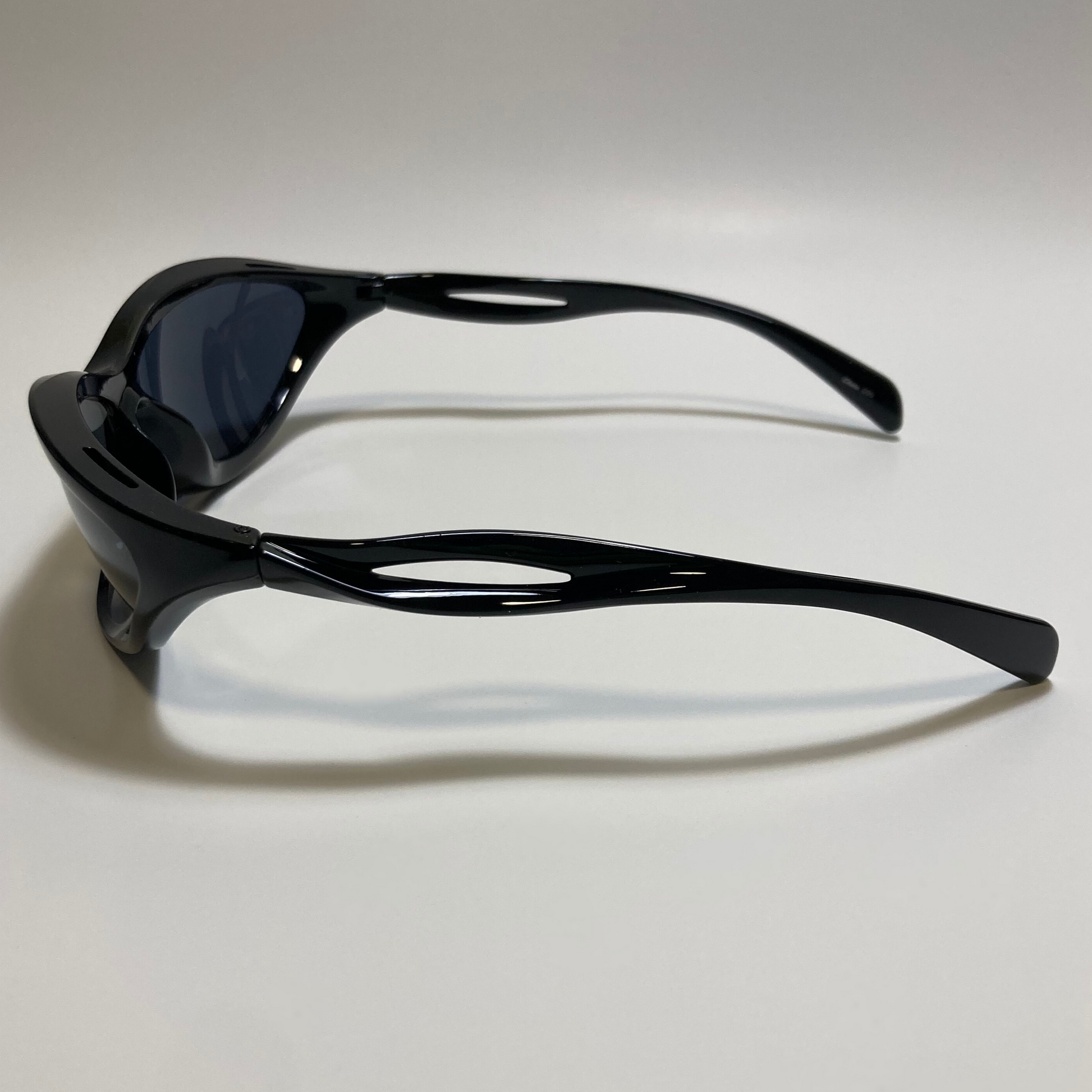 mens and womens gloss black and black lens futuristic sunglasses