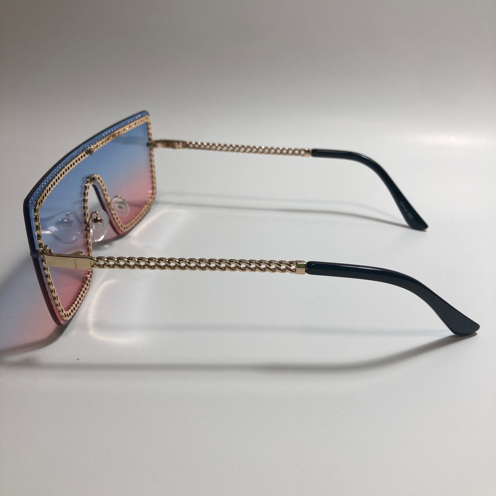 womens gold pink and blue shield sunglasses