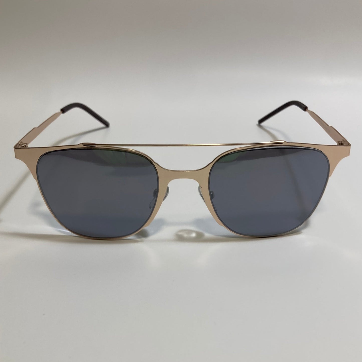 Square gold crossbar sunglasses with black lenses 