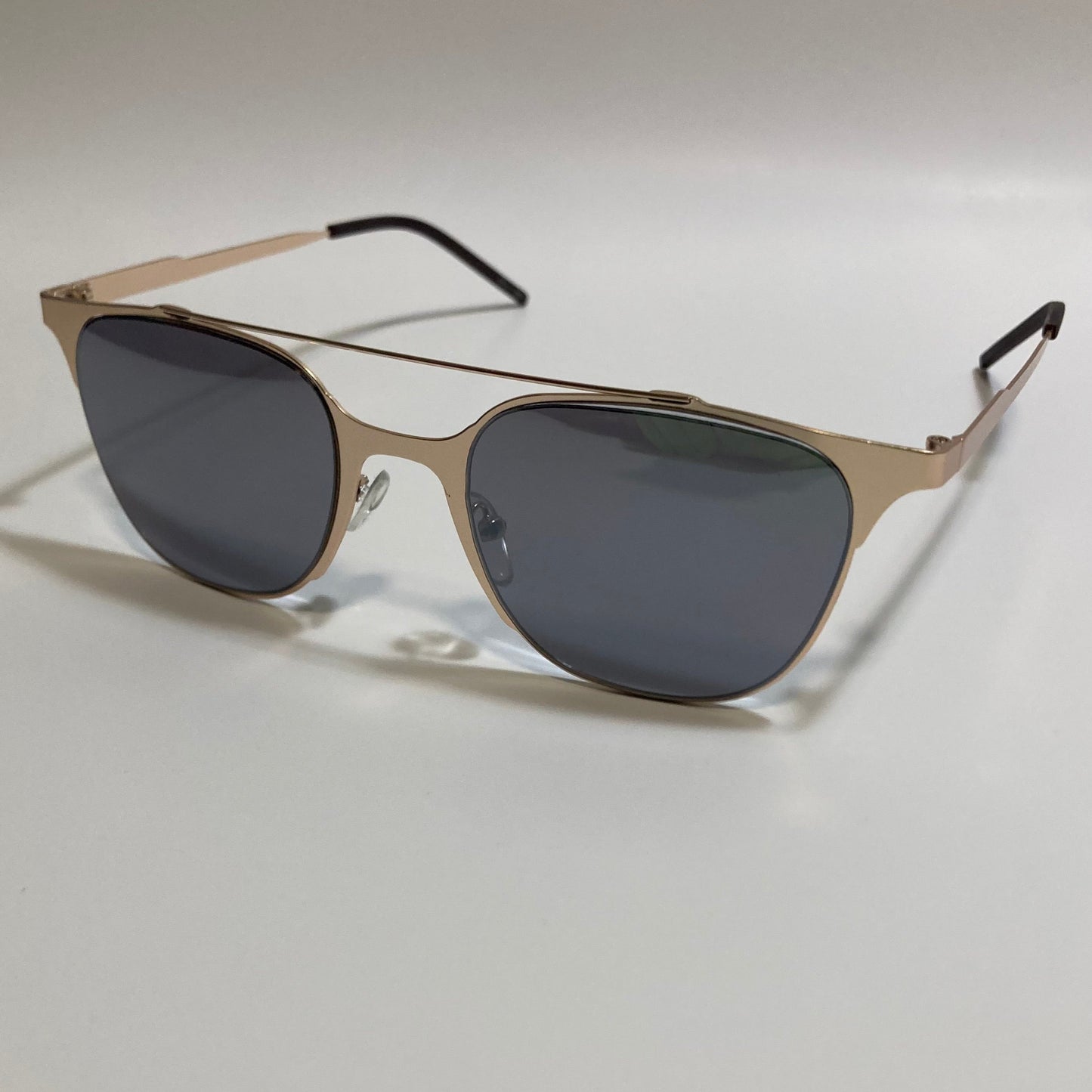 Square gold crossbar sunglasses with black lenses 
