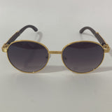 womens and mens gold and black round sunglasses 