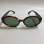 brown and green womens round sunglasses
