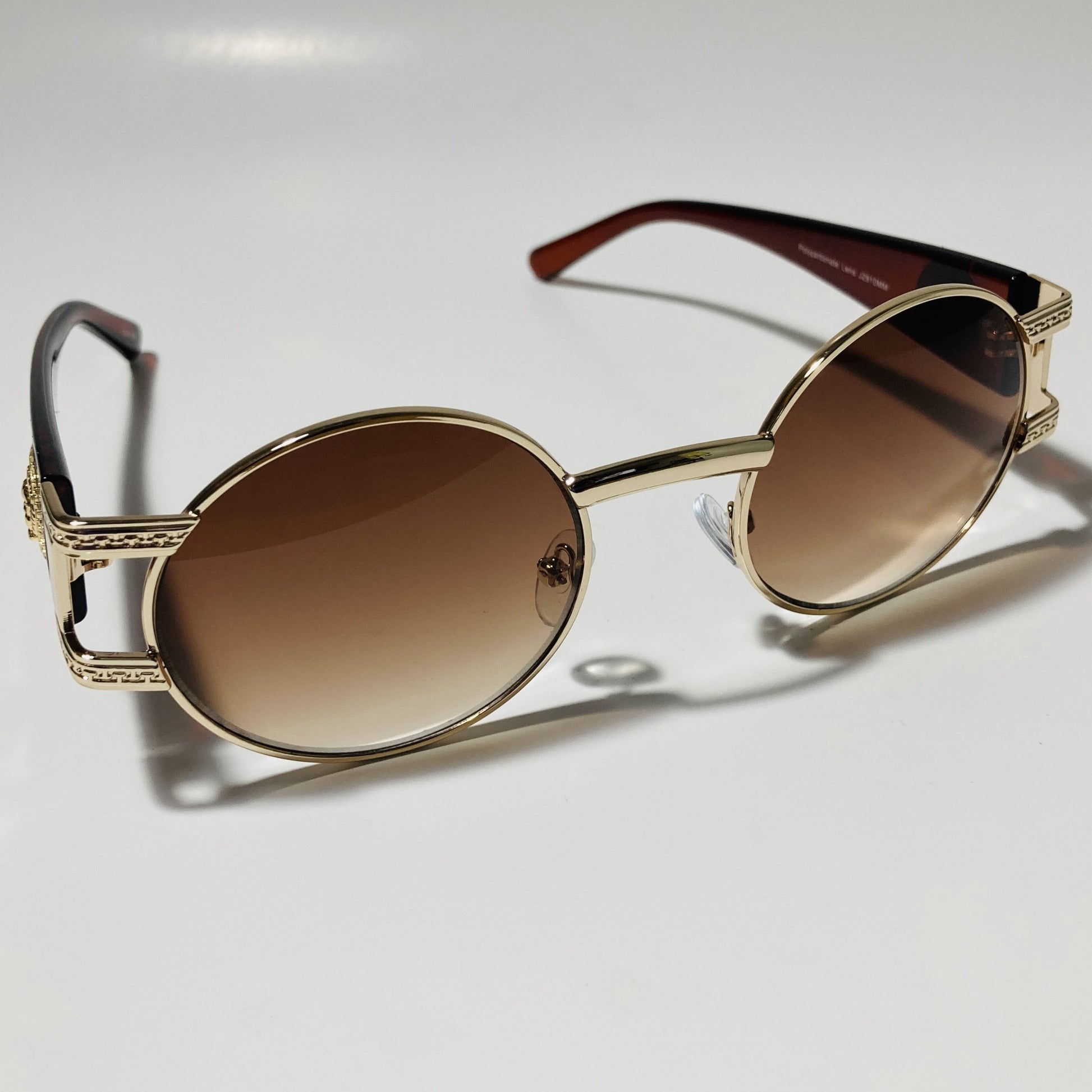 mens and womens brown and gold round sunglasses