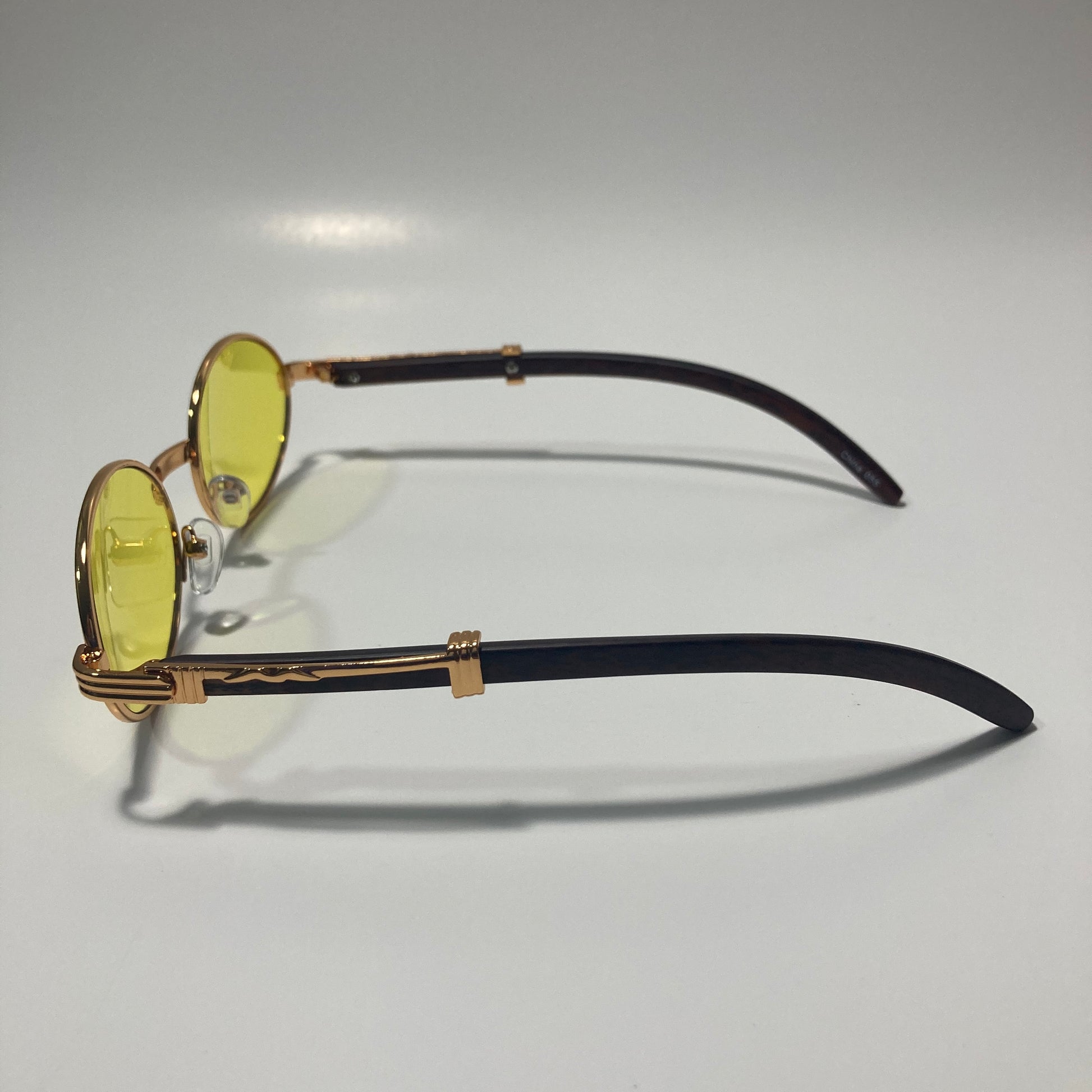 mens and womens yellow and gold round sunglasses