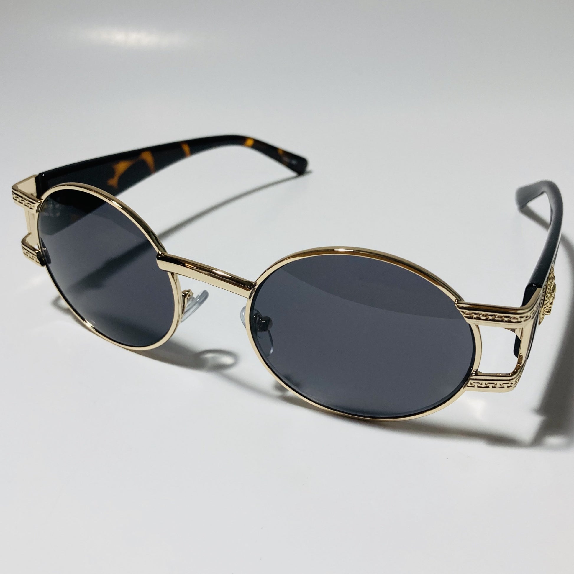 mens and womens black and gold round sunglasses
