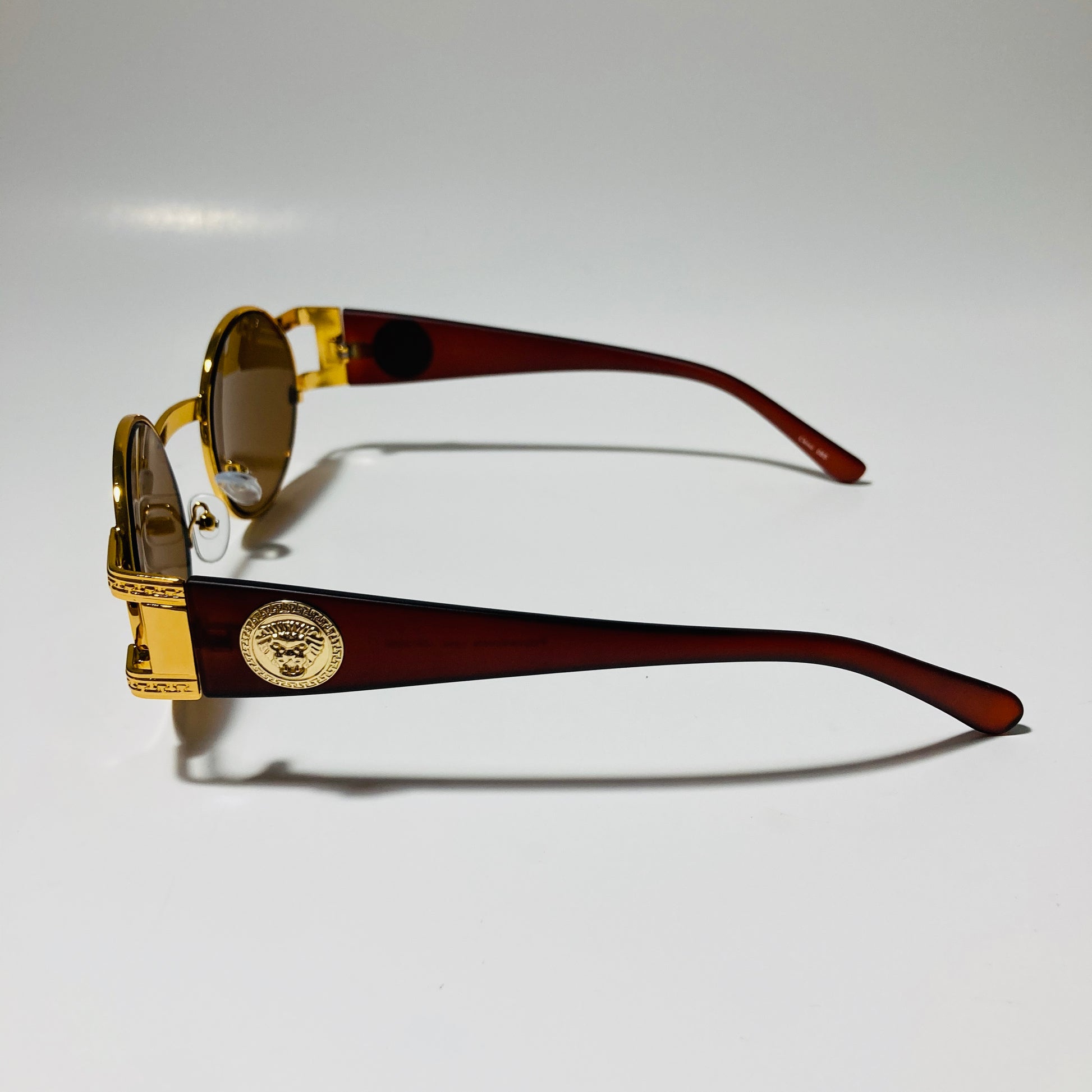 mens and womens brown and gold round sunglasses