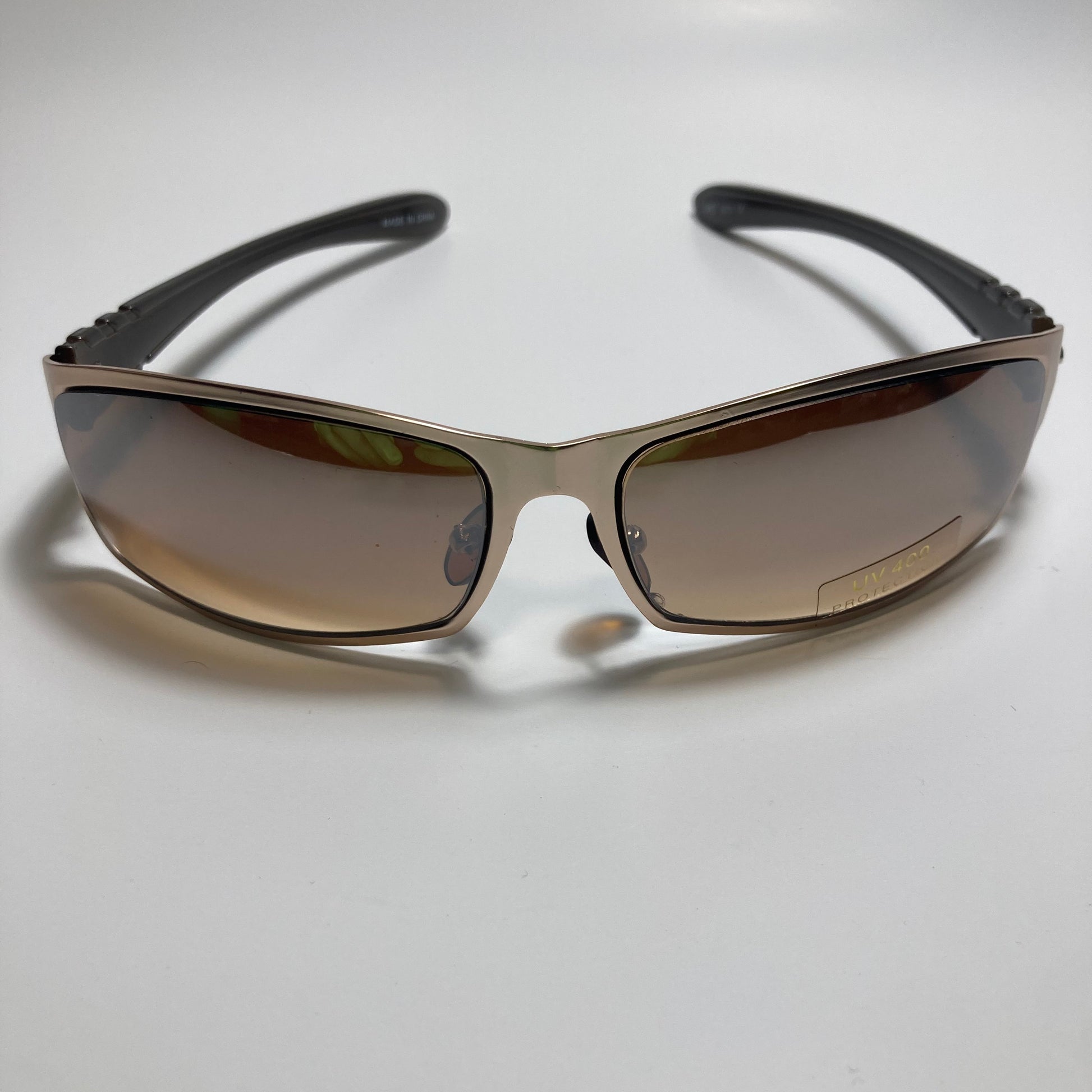 mens and womens brown and gold metal wrap around sunglasses