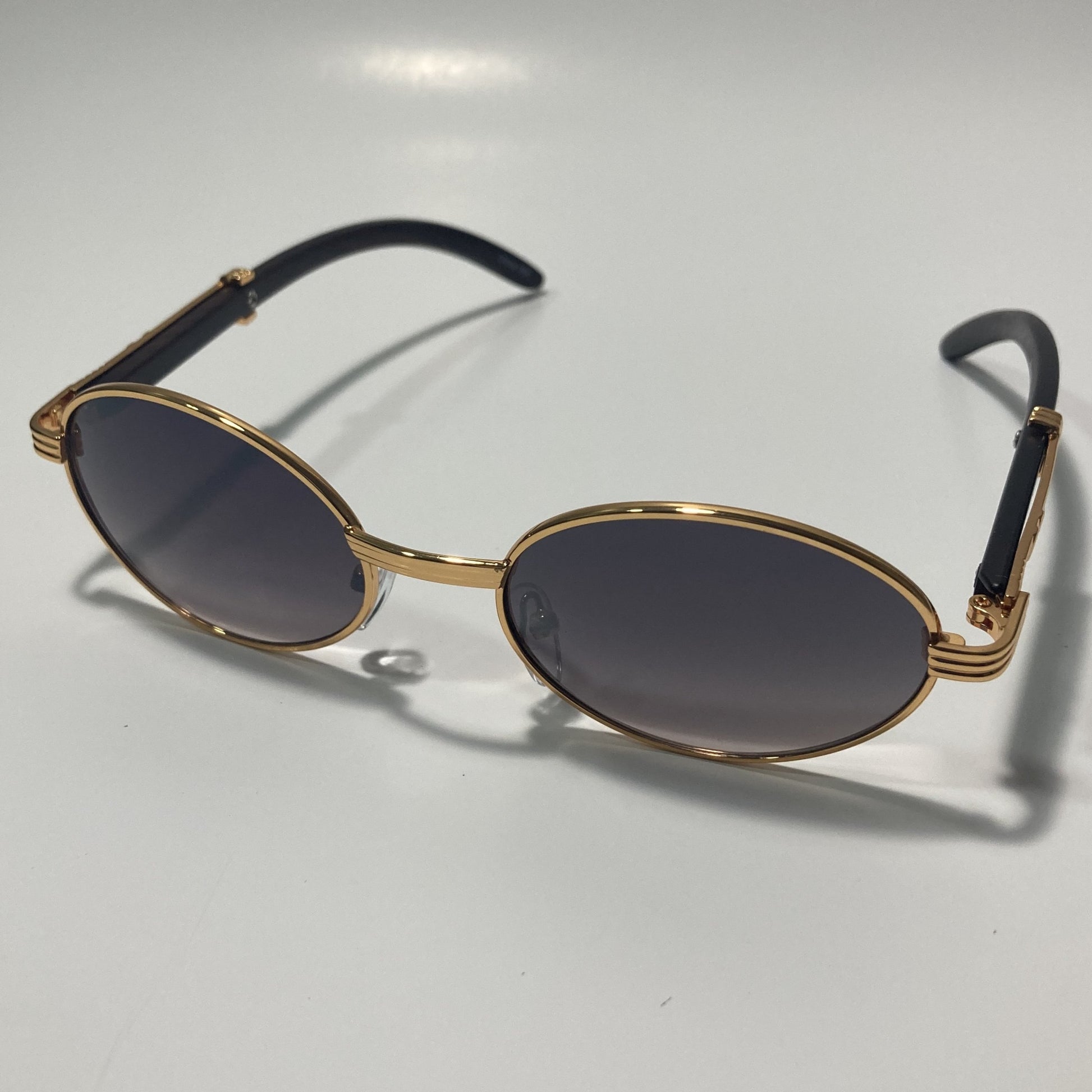 mens and womens gray and gold round sunglasses
