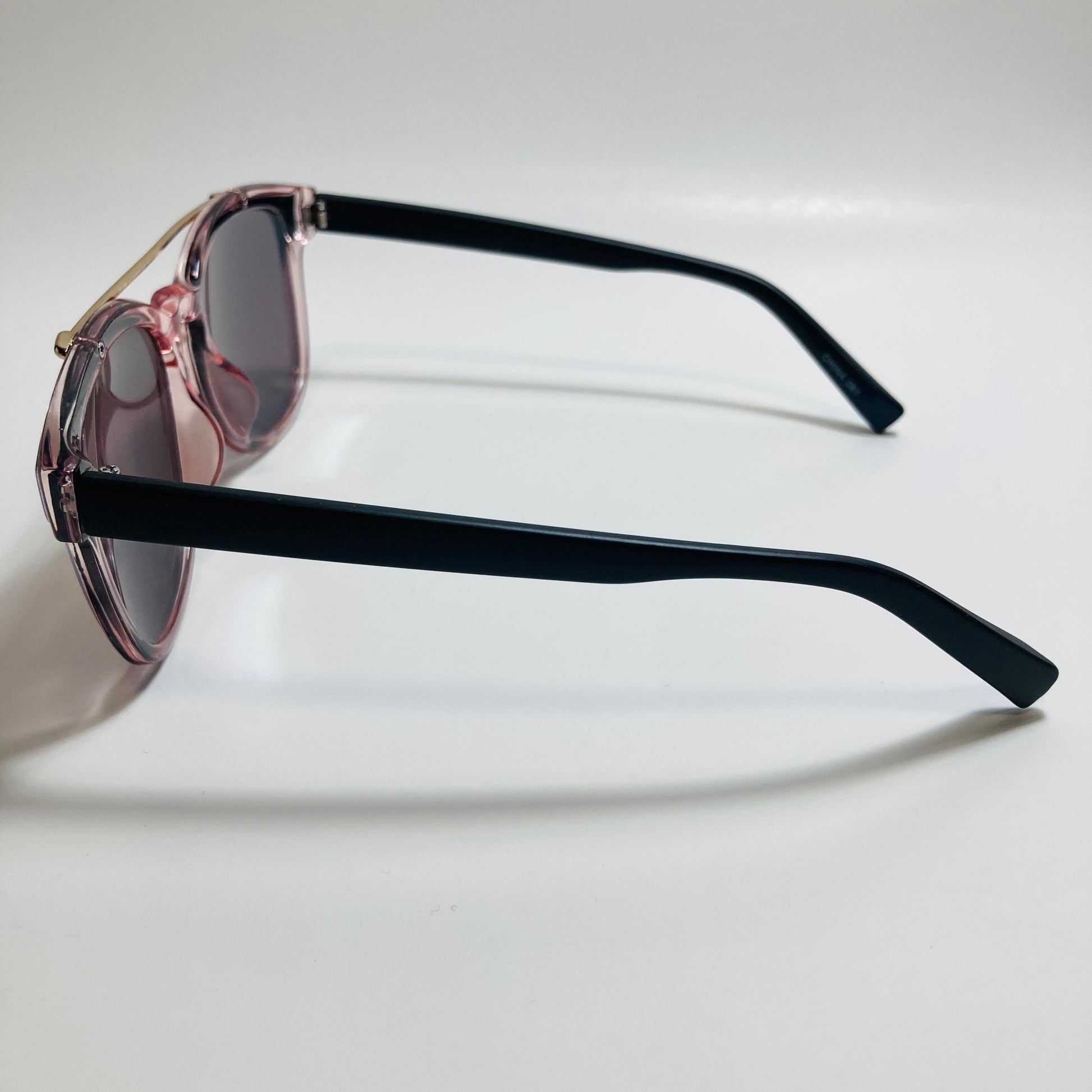 mens and womens pink black and green mirrored round sunglasses with crossbar 