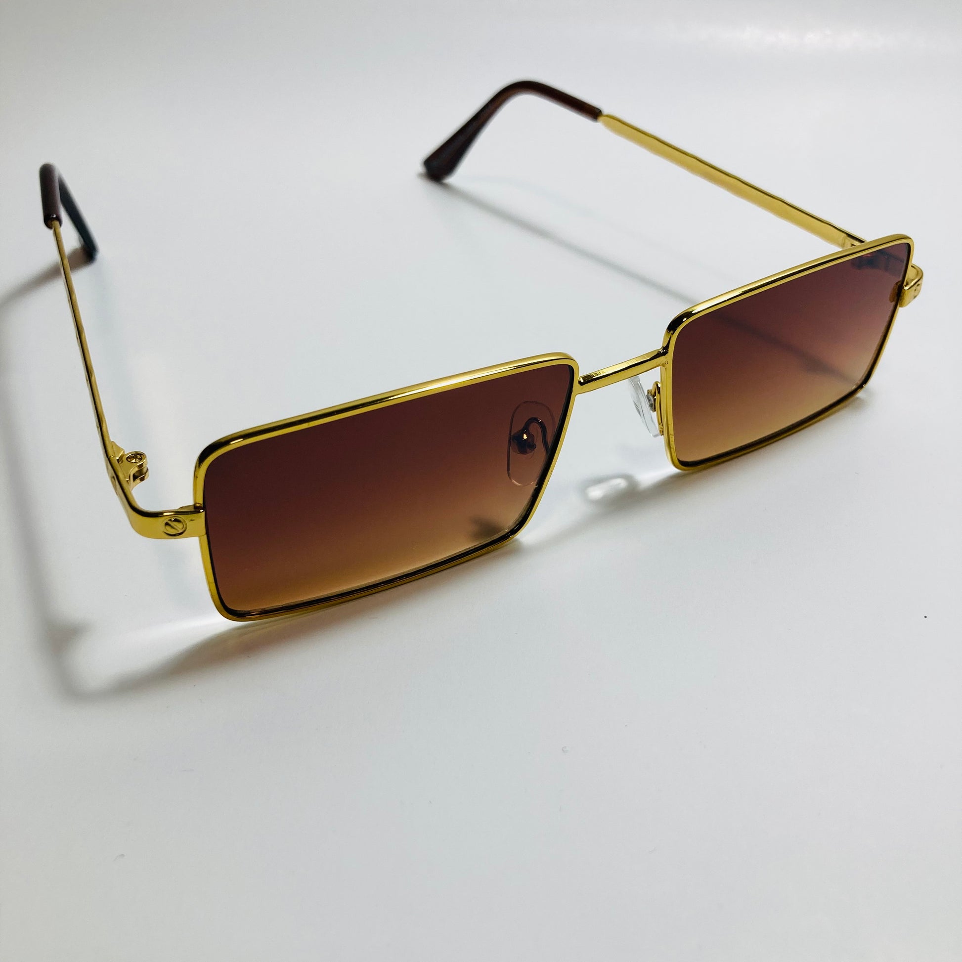 Mens and womens gold sunglasses with brown lenses