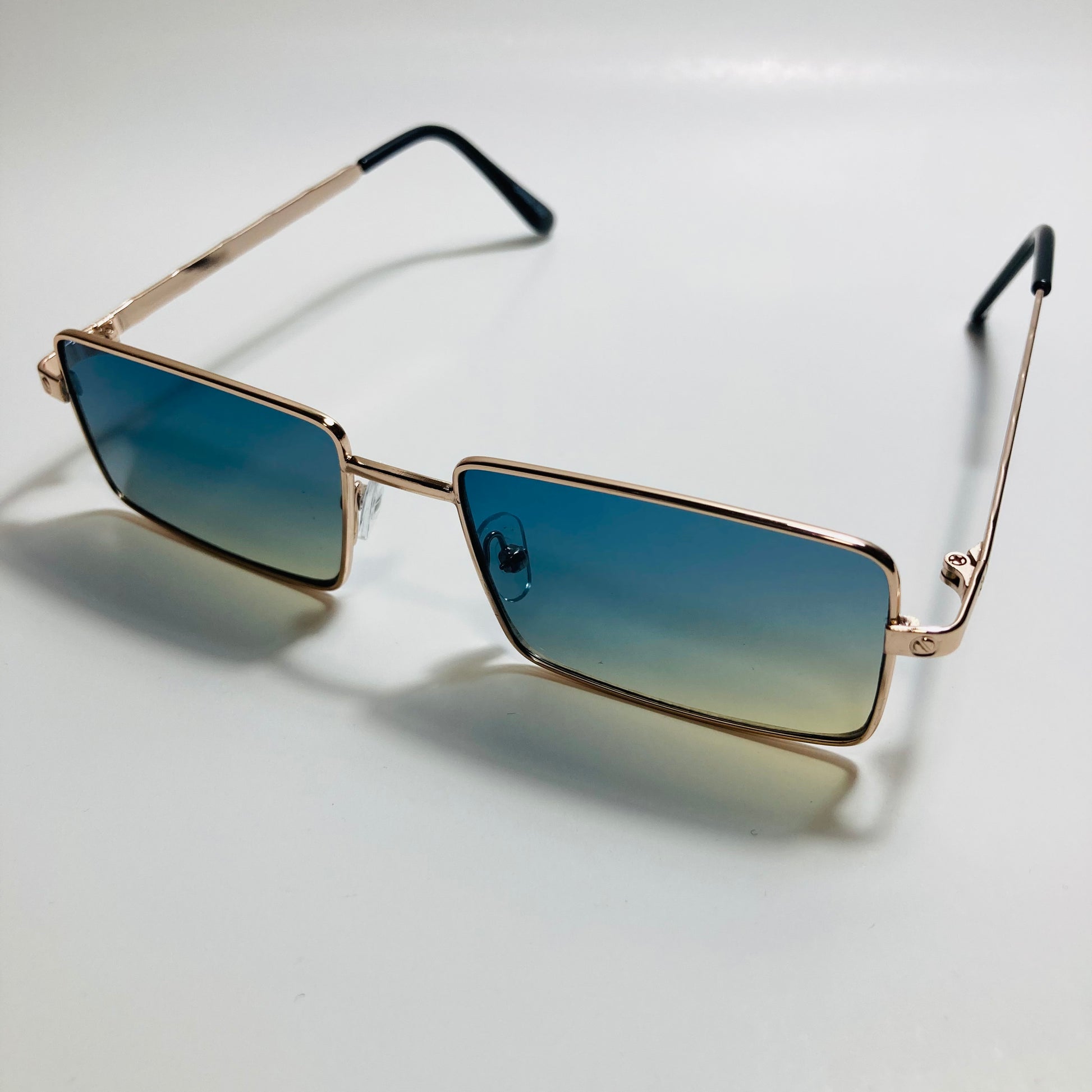 Mens and womens gold sunglasses with green lenses