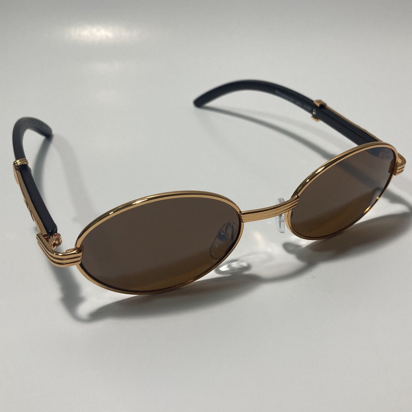 mens and womens brown and gold round sunglasses