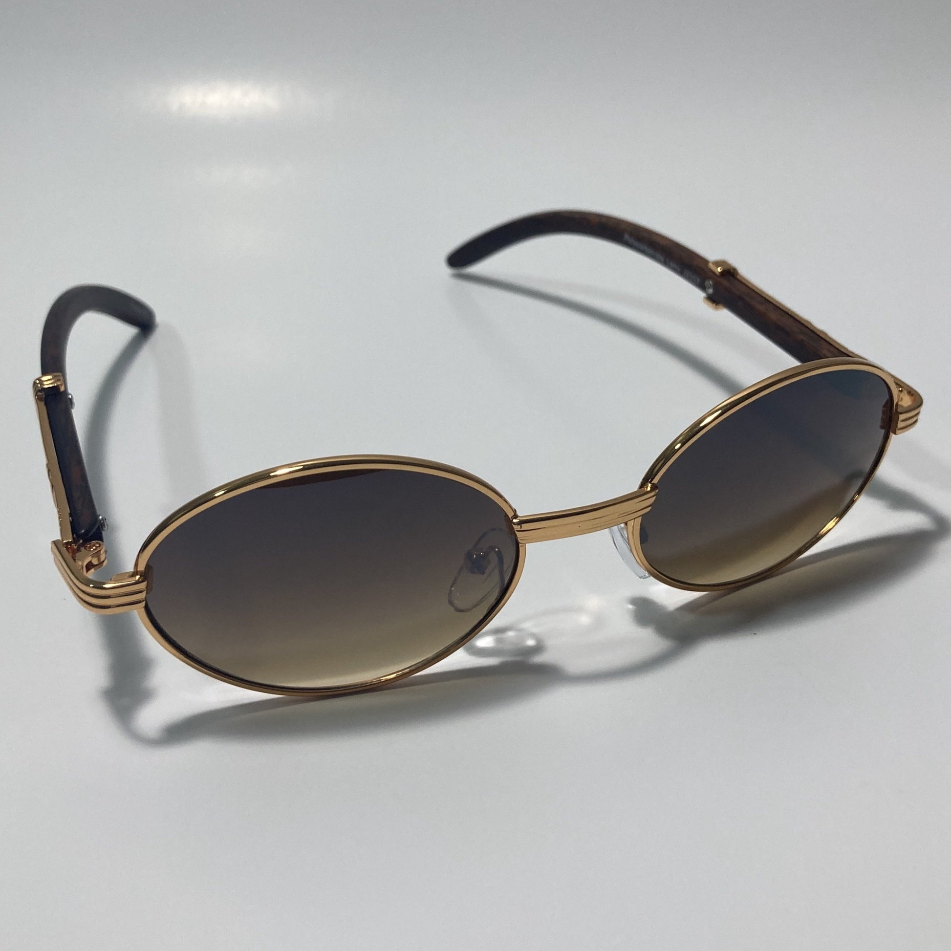 mens and womens brown and gold round sunglasses