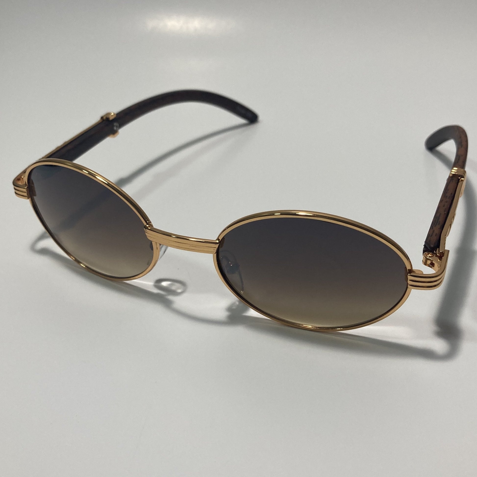 mens and womens brown and gold round sunglasses