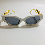 white and black square womens sunglasses with gold arms 