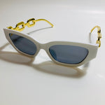 white and black square womens sunglasses with gold arms 