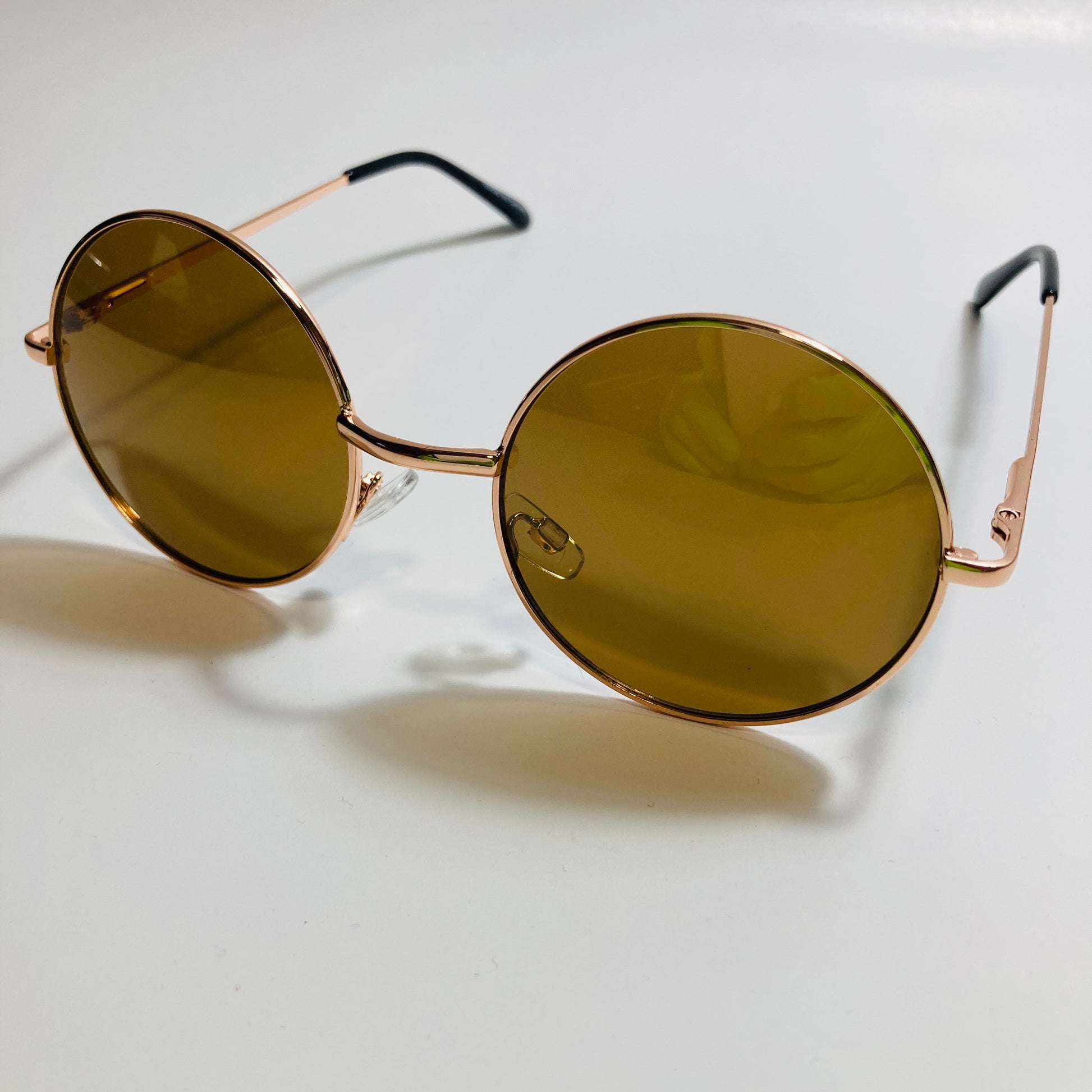 mens and womens gold and brown round sunglasses