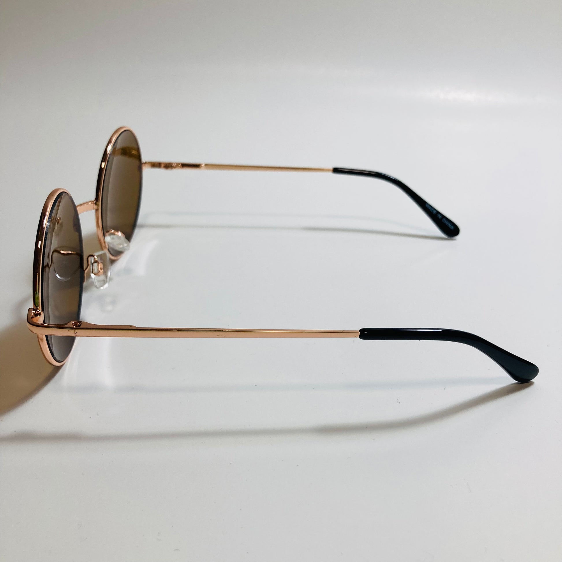 mens and womens gold and brown round sunglasses