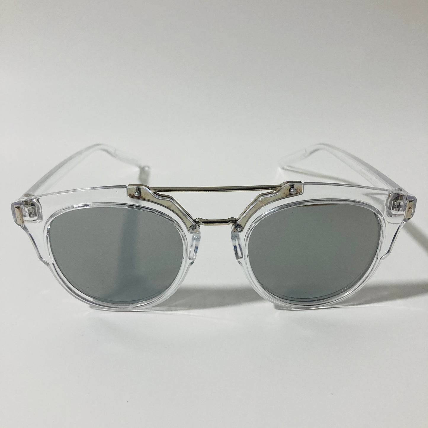 mens and womens clear silver and black round sunglasses with crossbar