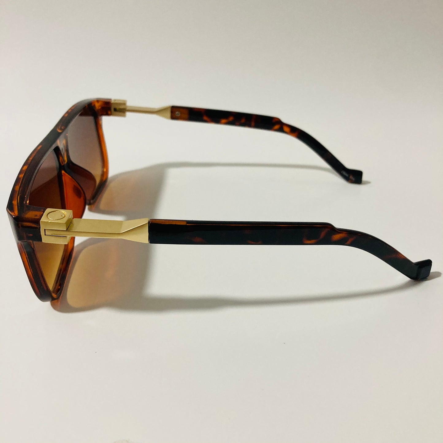 mens and womens brown and gold square sunglasses