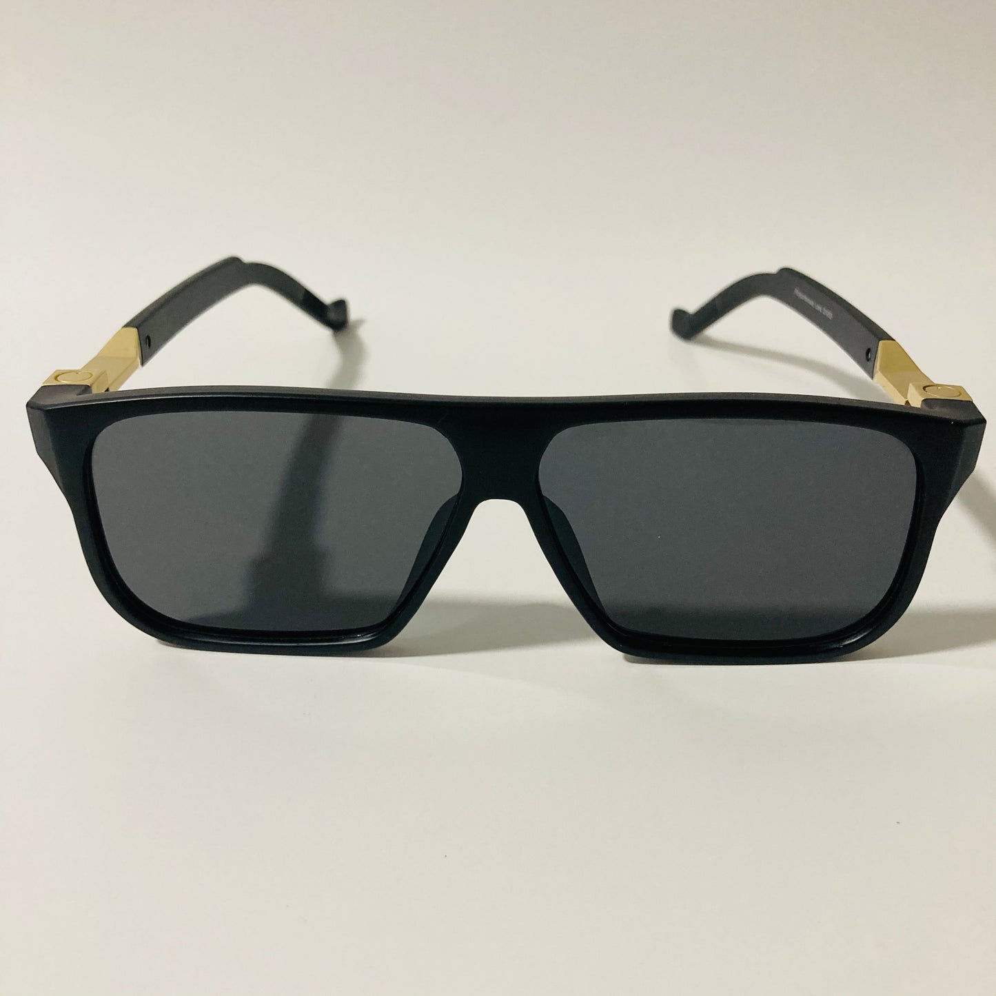 mens and womens black and gold square sunglasses