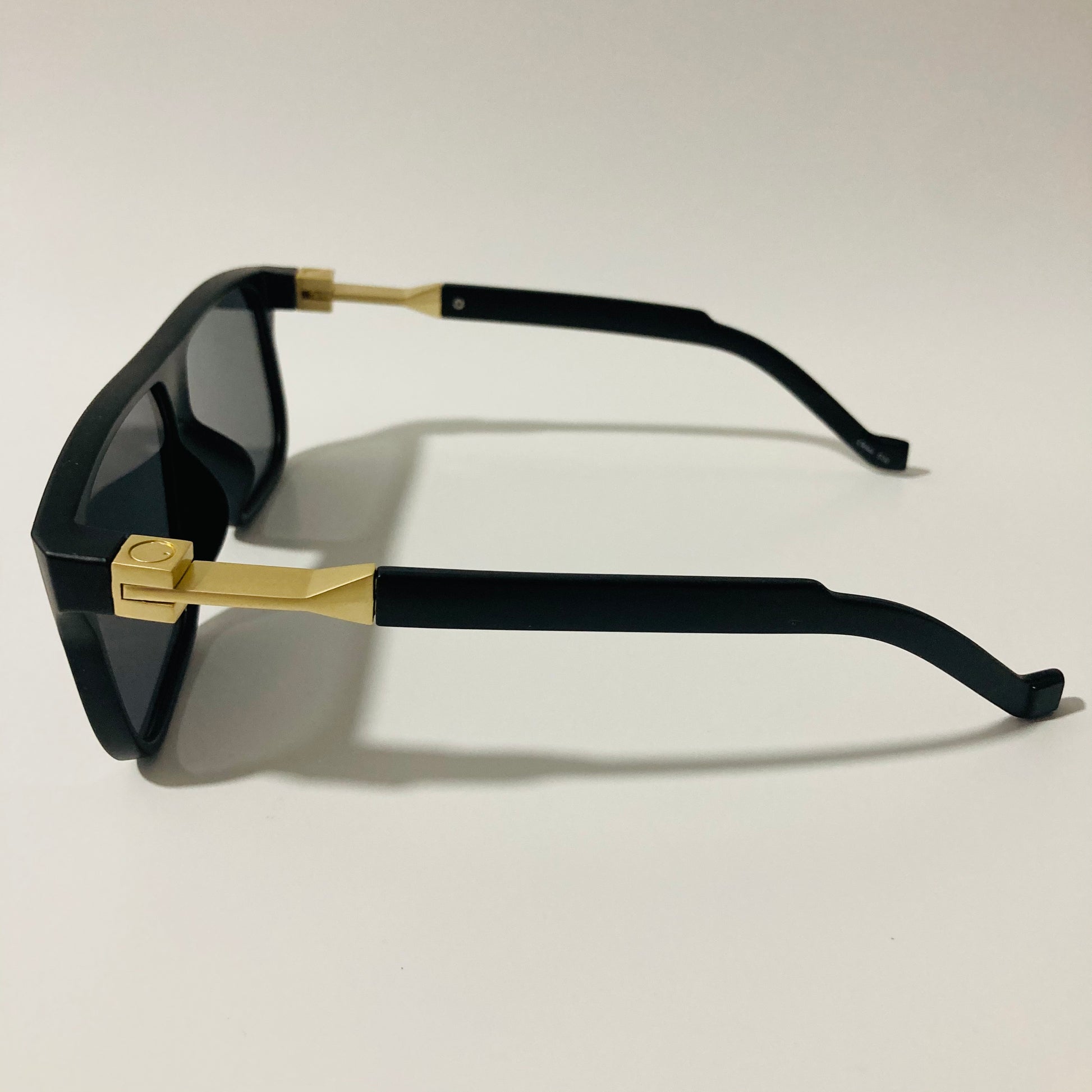 mens and womens black and gold square sunglasses