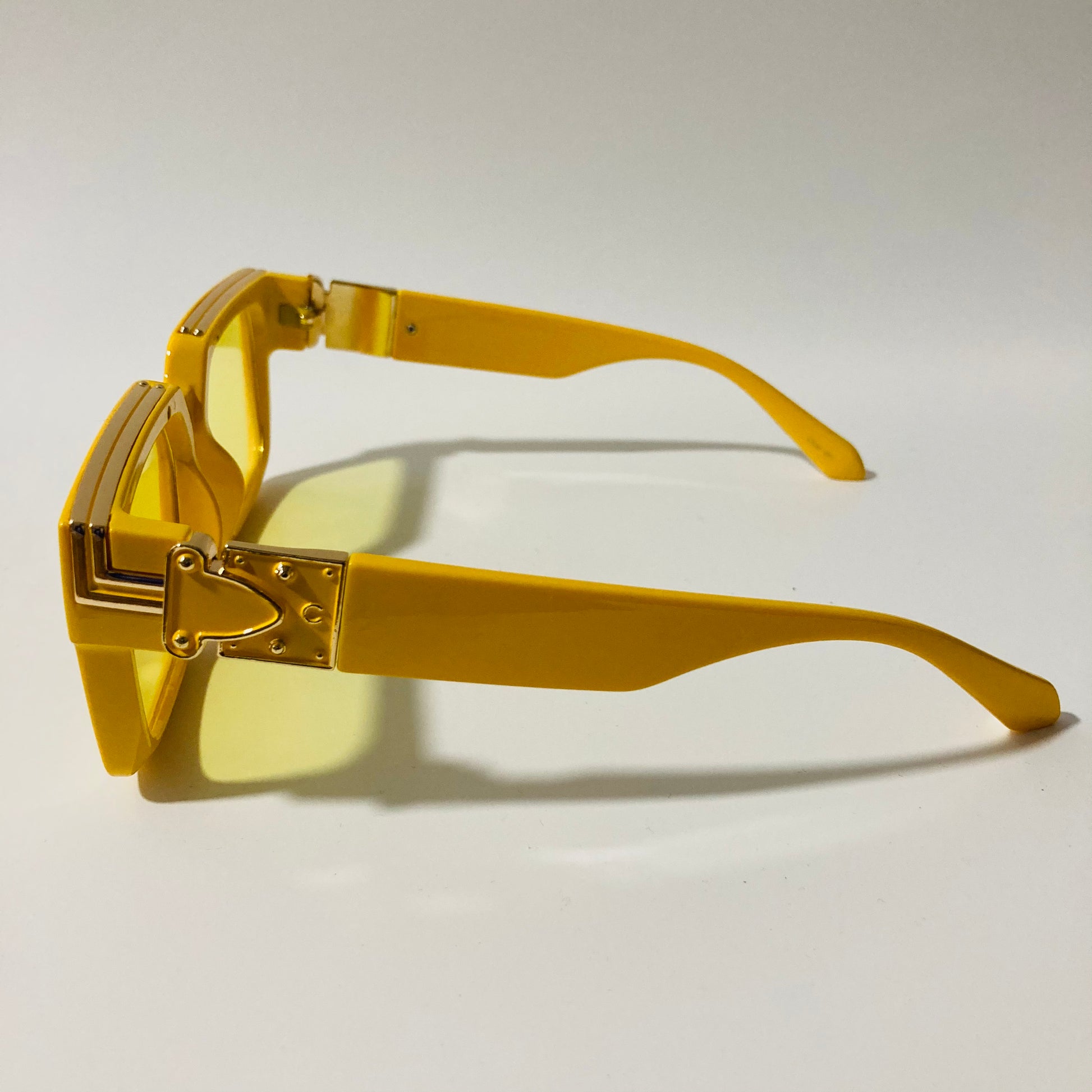 mens and womens yellow square sunglasses with gold accents