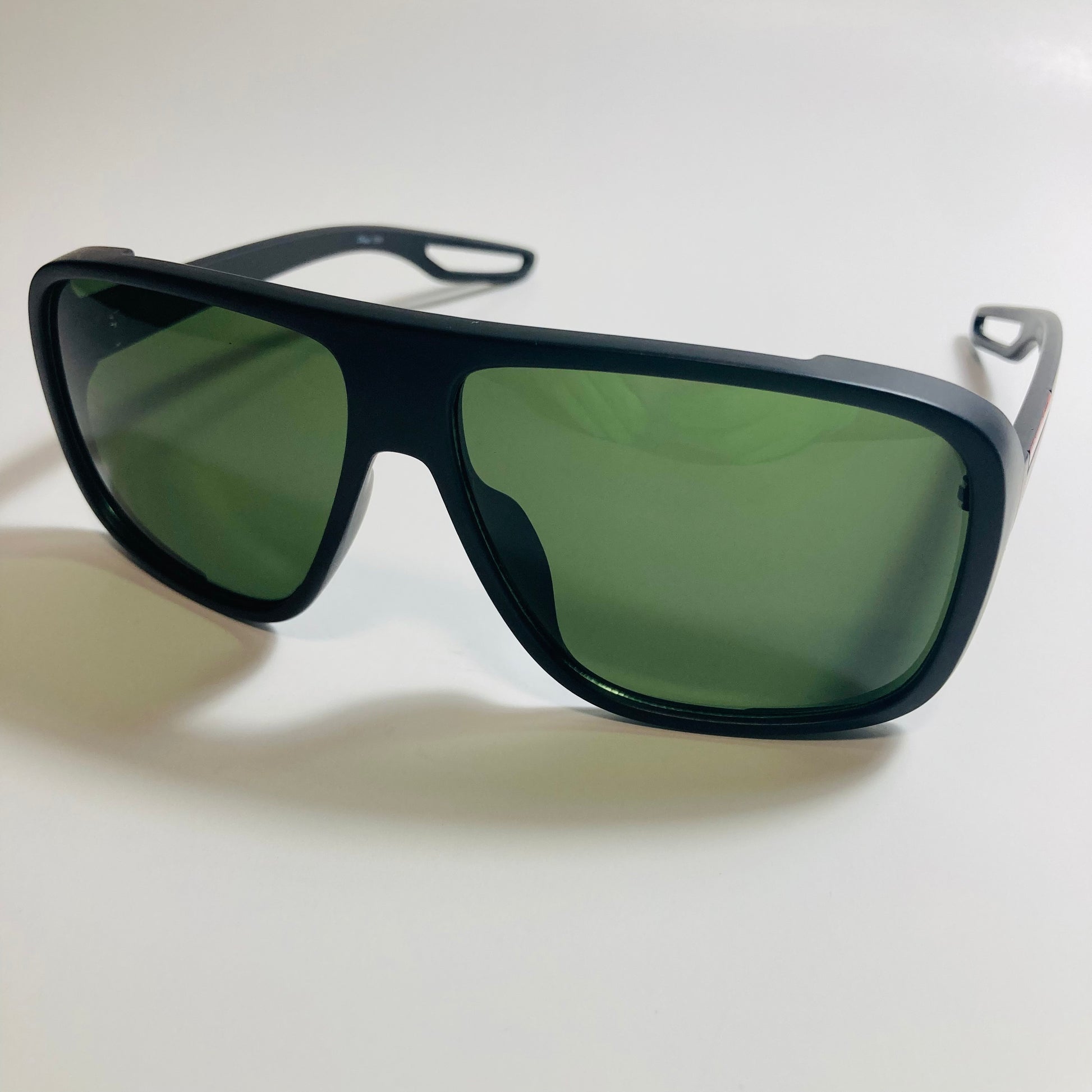 mens and womens black square sunglasses with green lenses