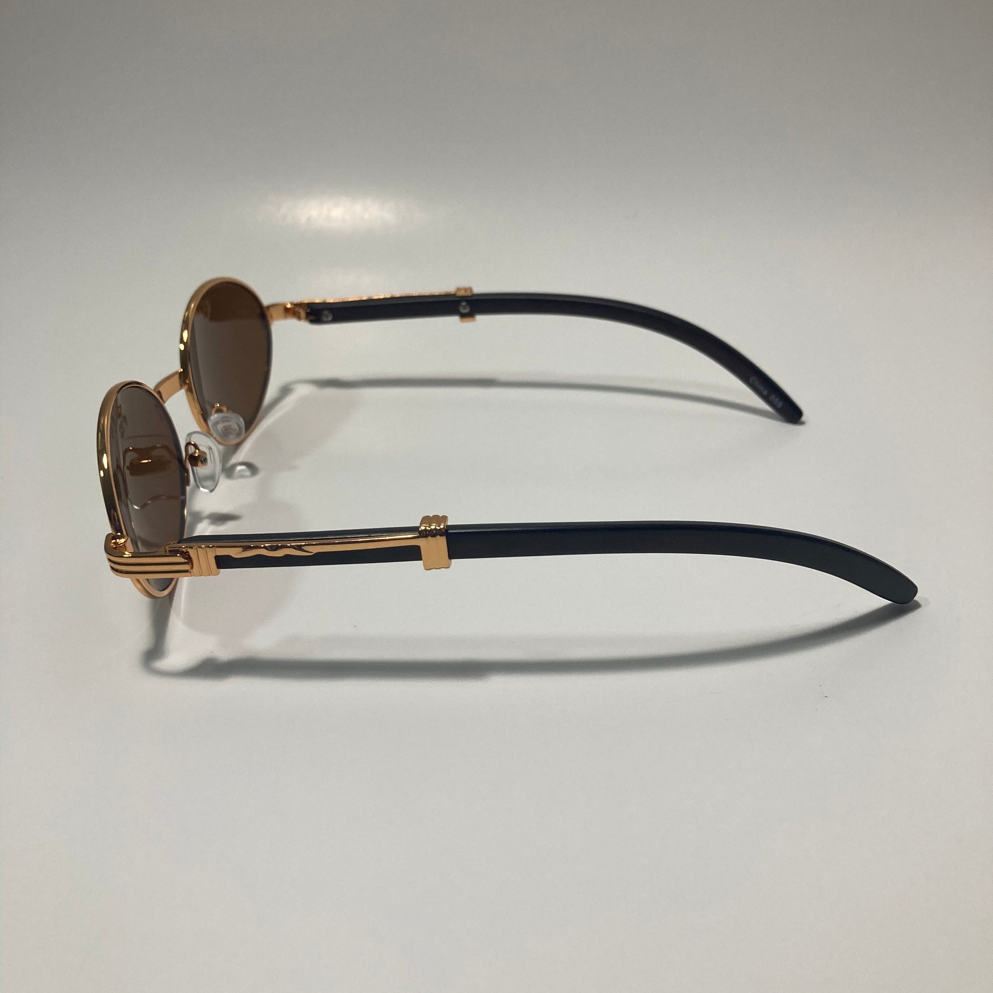 mens and womens brown and gold round sunglasses