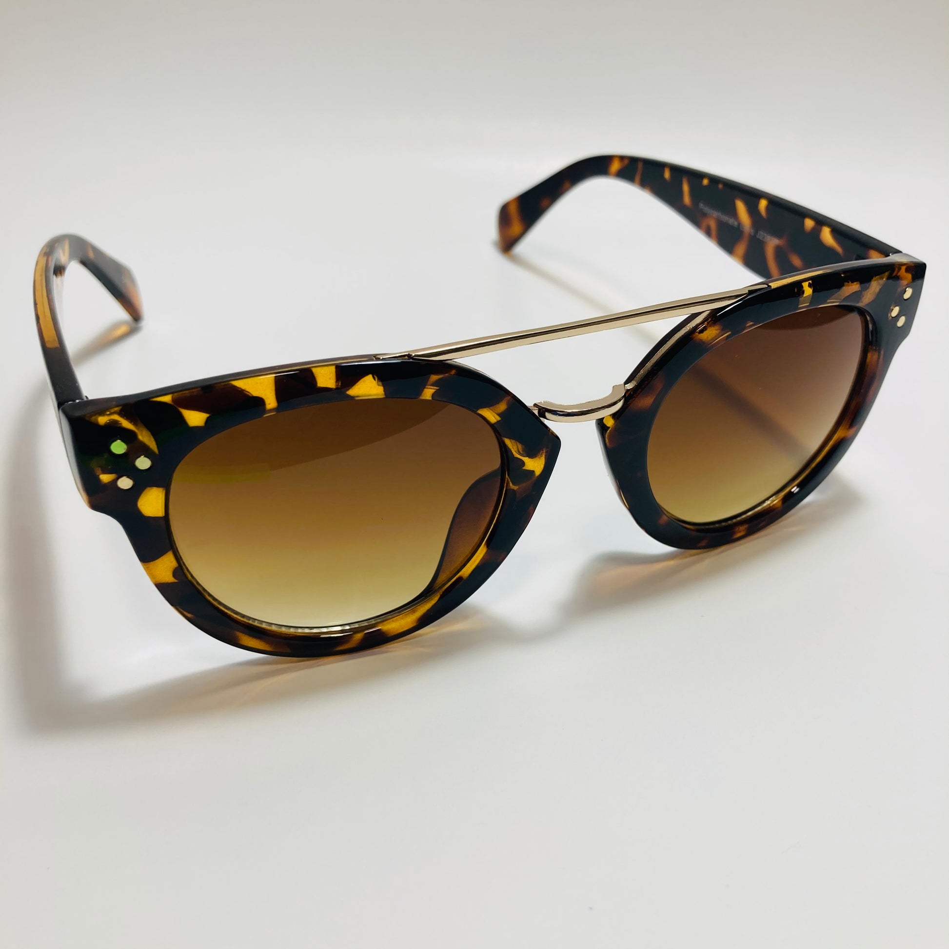 womens brown and gold round sunglasses