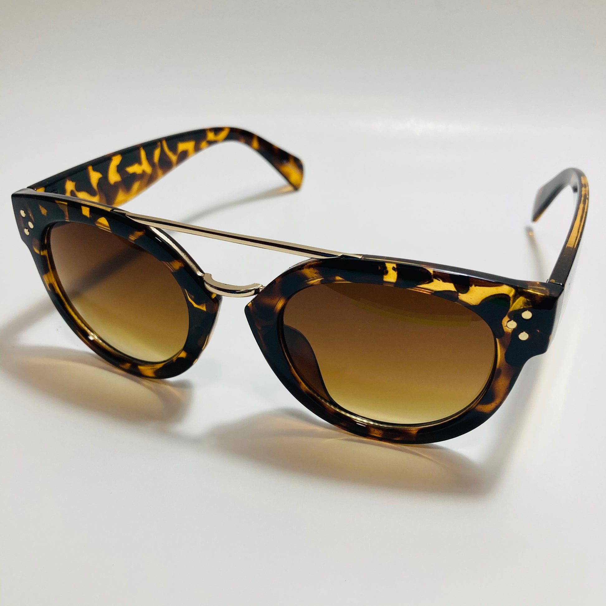 womens brown and gold round sunglasses