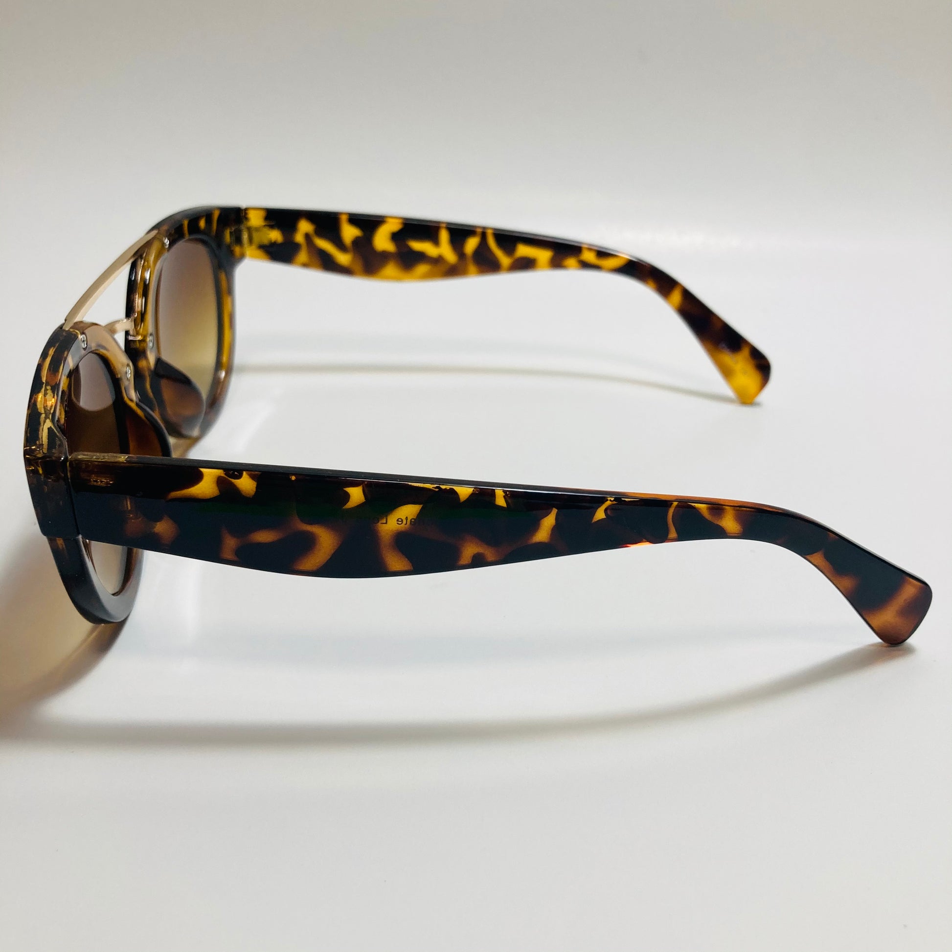 womens brown and gold round sunglasses