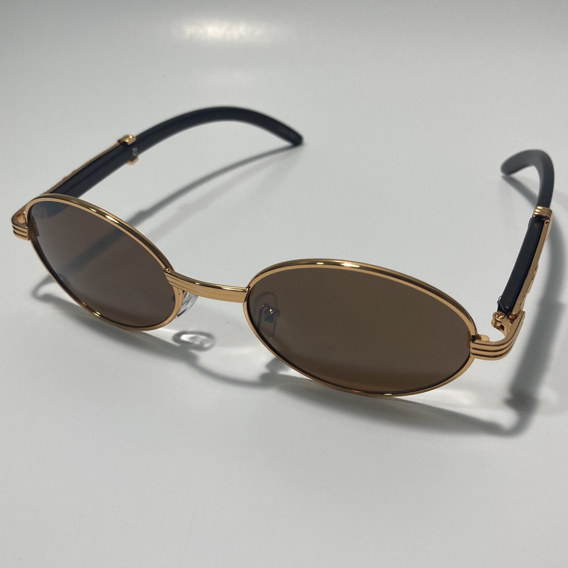 mens and womens brown and gold round sunglasses