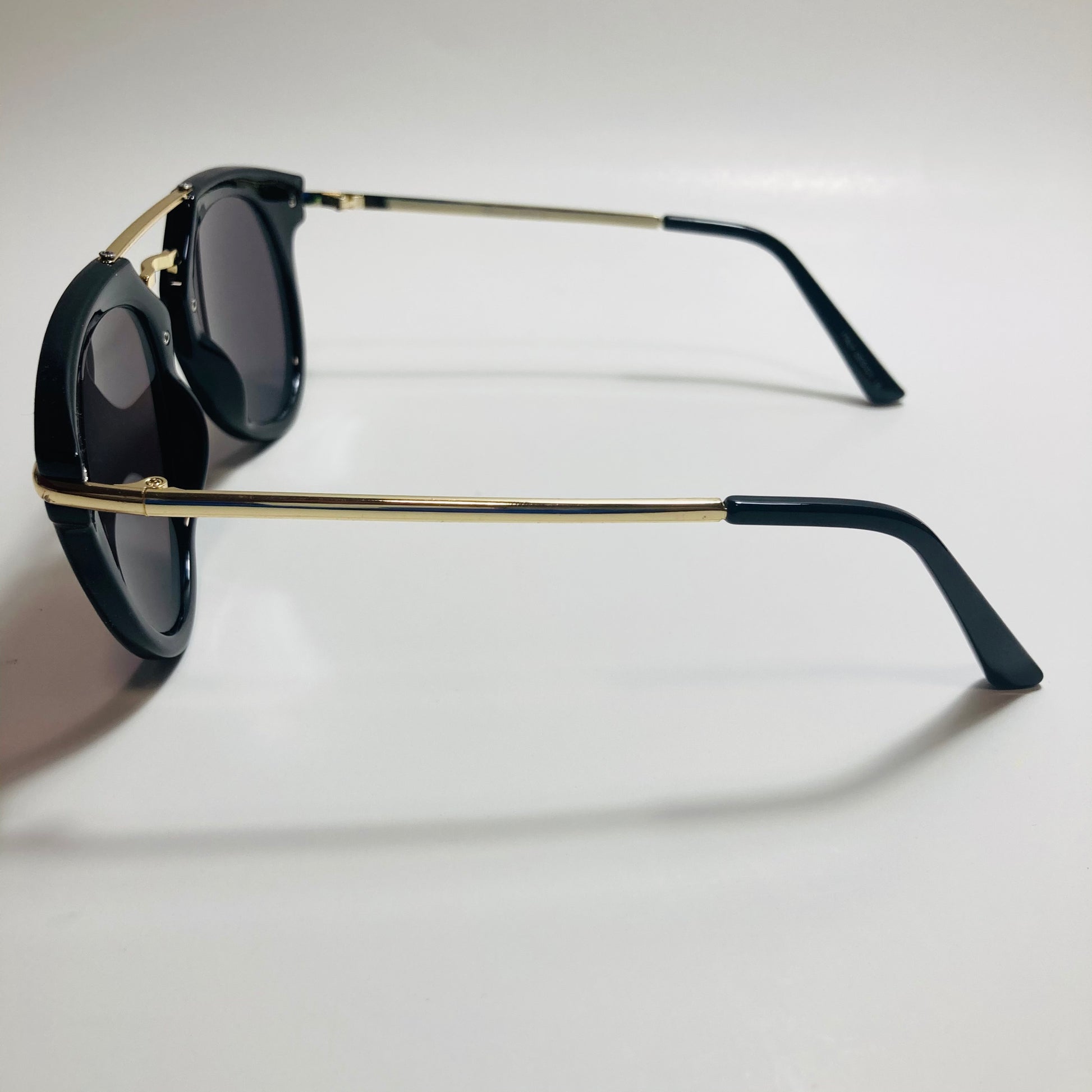 mens and womens black gold and green mirrored round sunglasses with crossbar