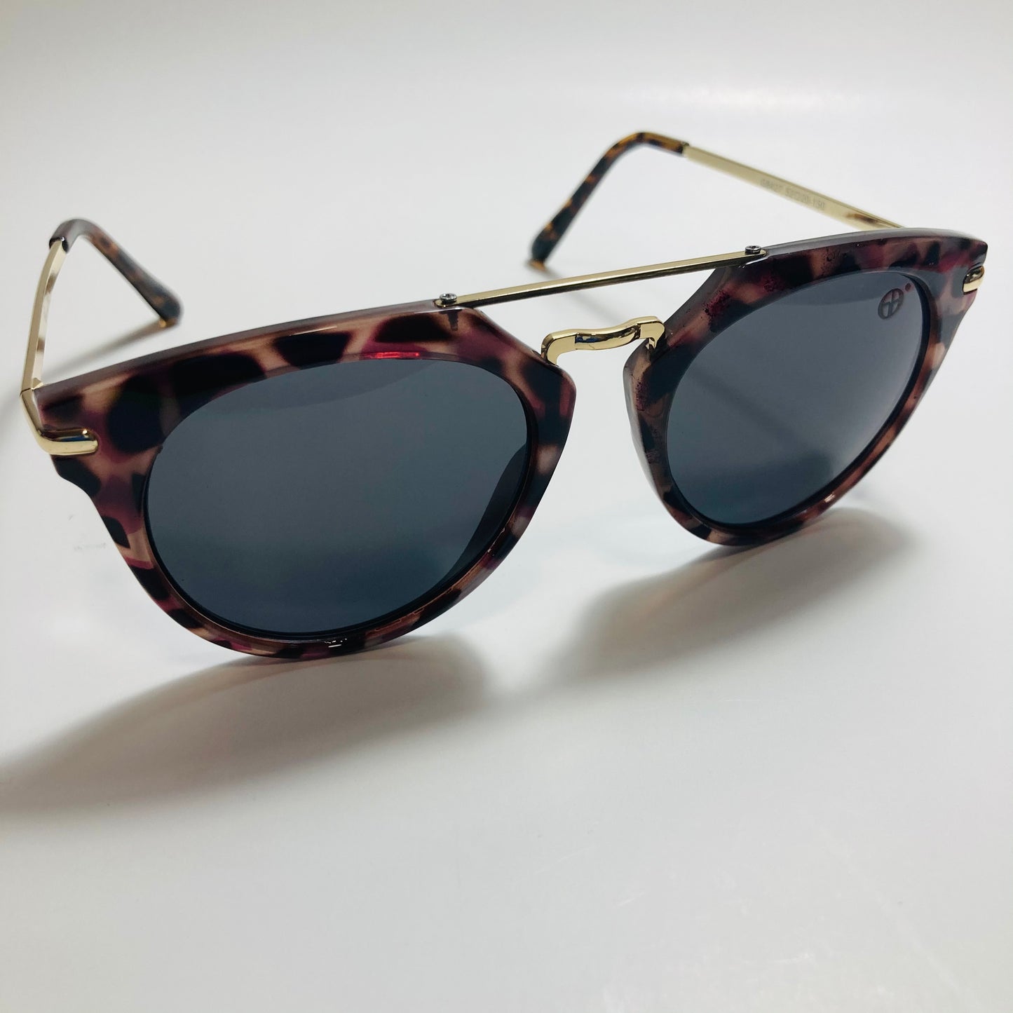 mens and womens black gold and brown mirrored round sunglasses with crossbar