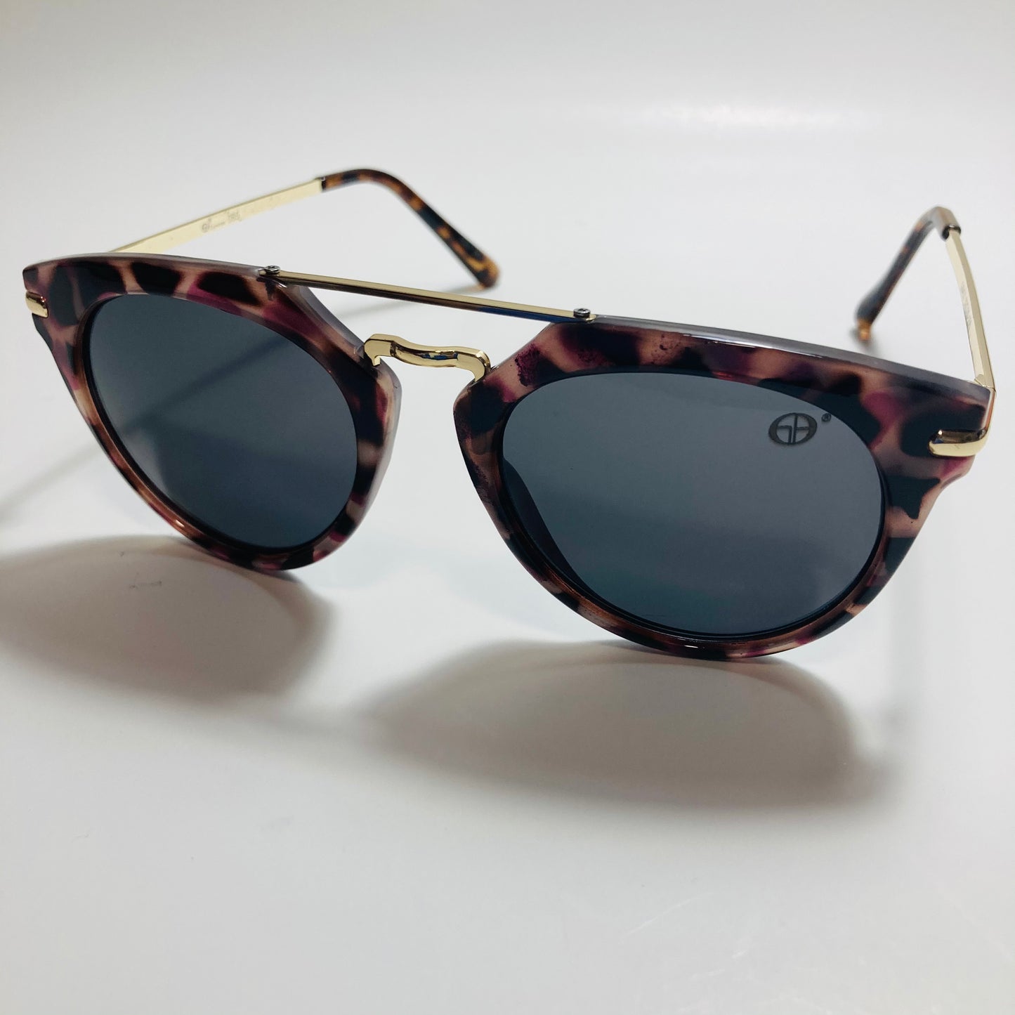 mens and womens black gold and brown mirrored round sunglasses with crossbar