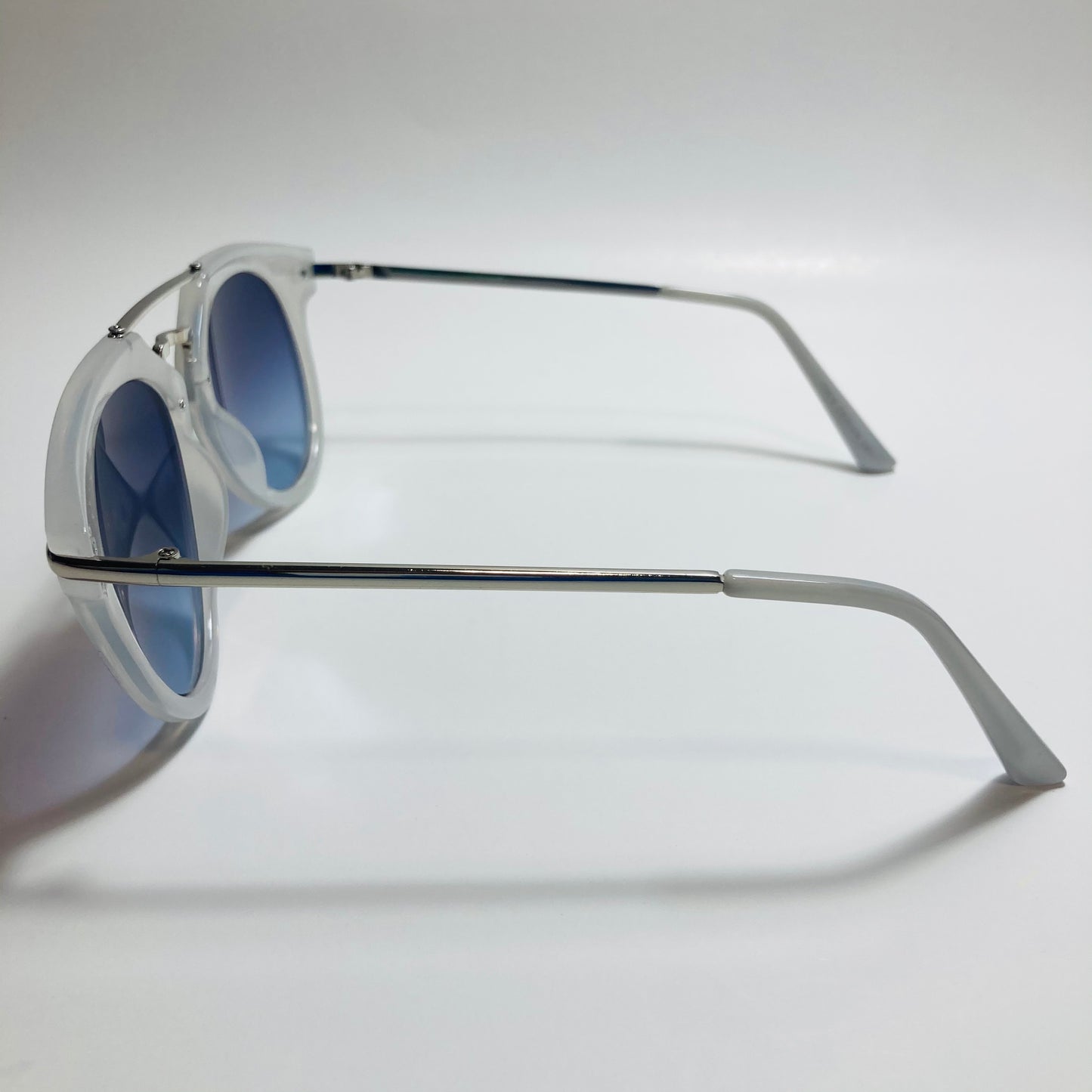 mens and womens silver clear and gray round sunglasses with crossbar