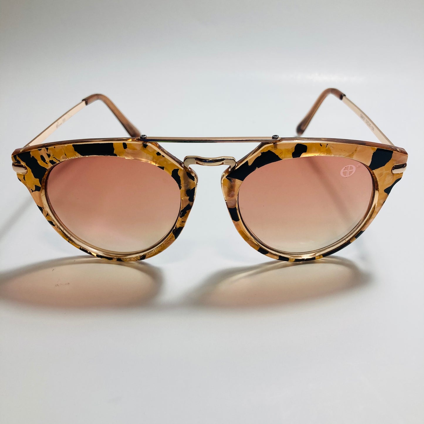womens pink and gold round sunglasses with crossbar