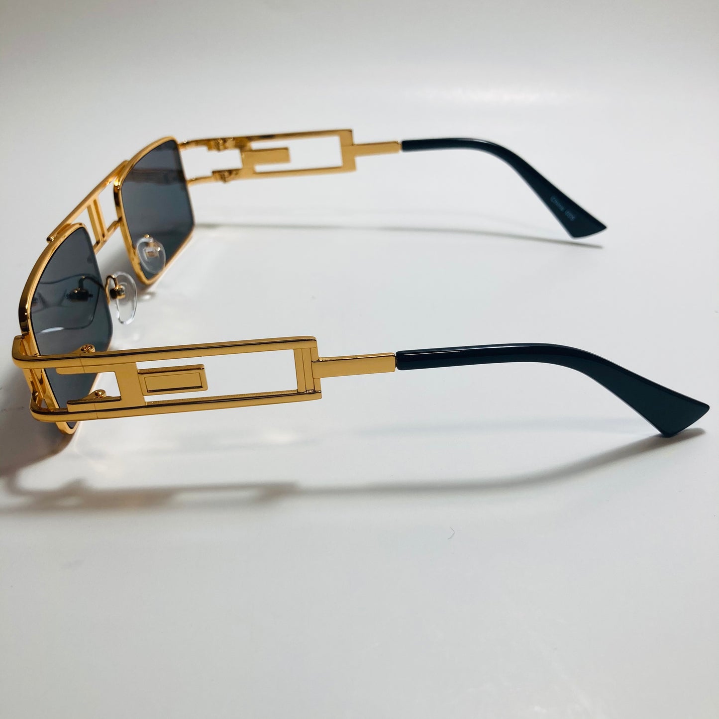 mens and womens black and gold square sunglasses