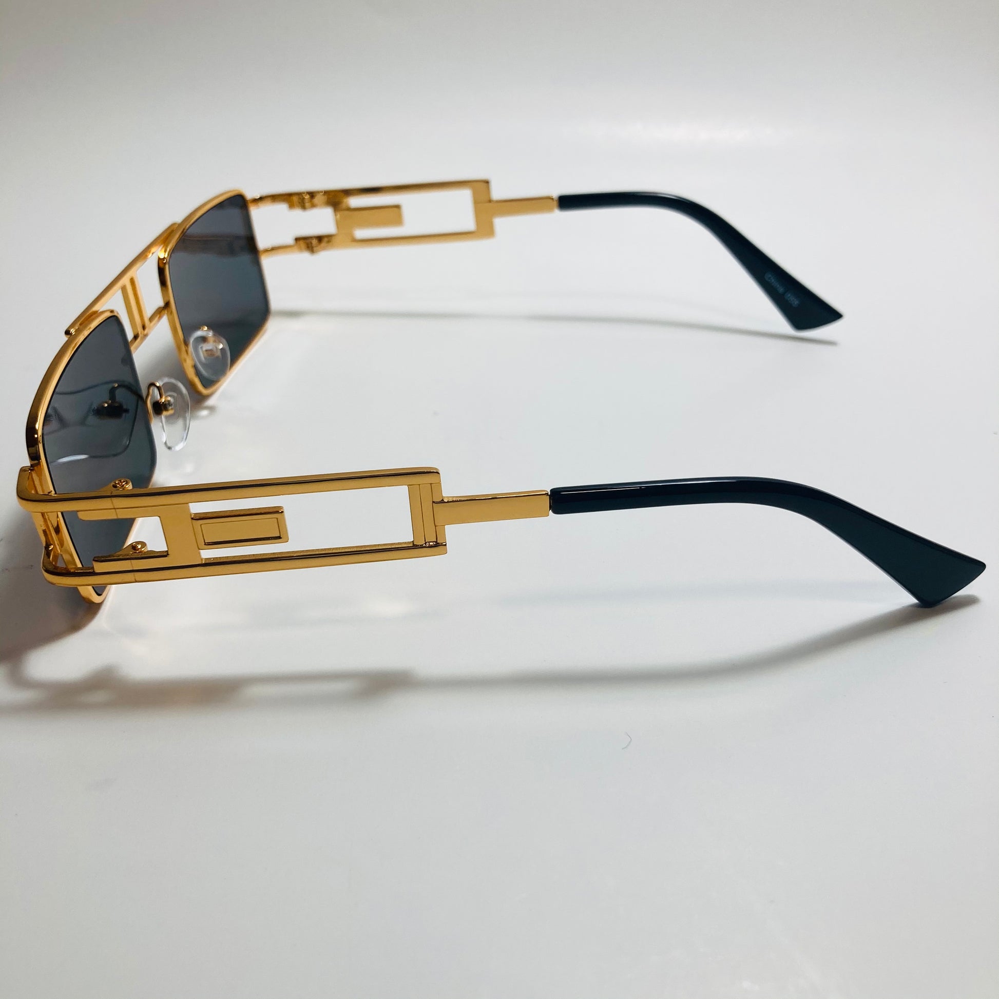 mens and womens black and gold square sunglasses
